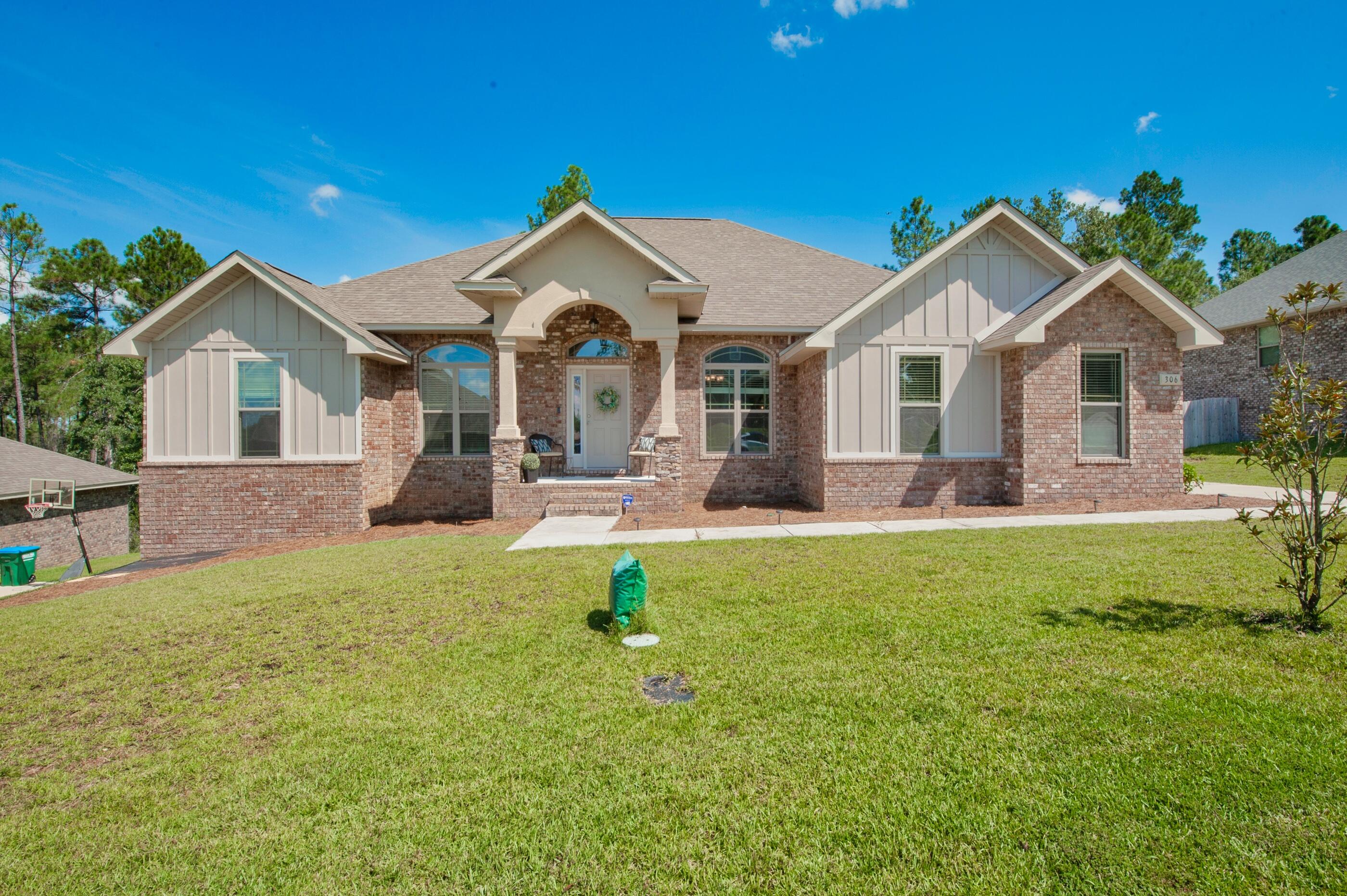 306 Vale Loop Crestview, FL 32536 - Photo 1 of 40 a front view of house with yard and green space
