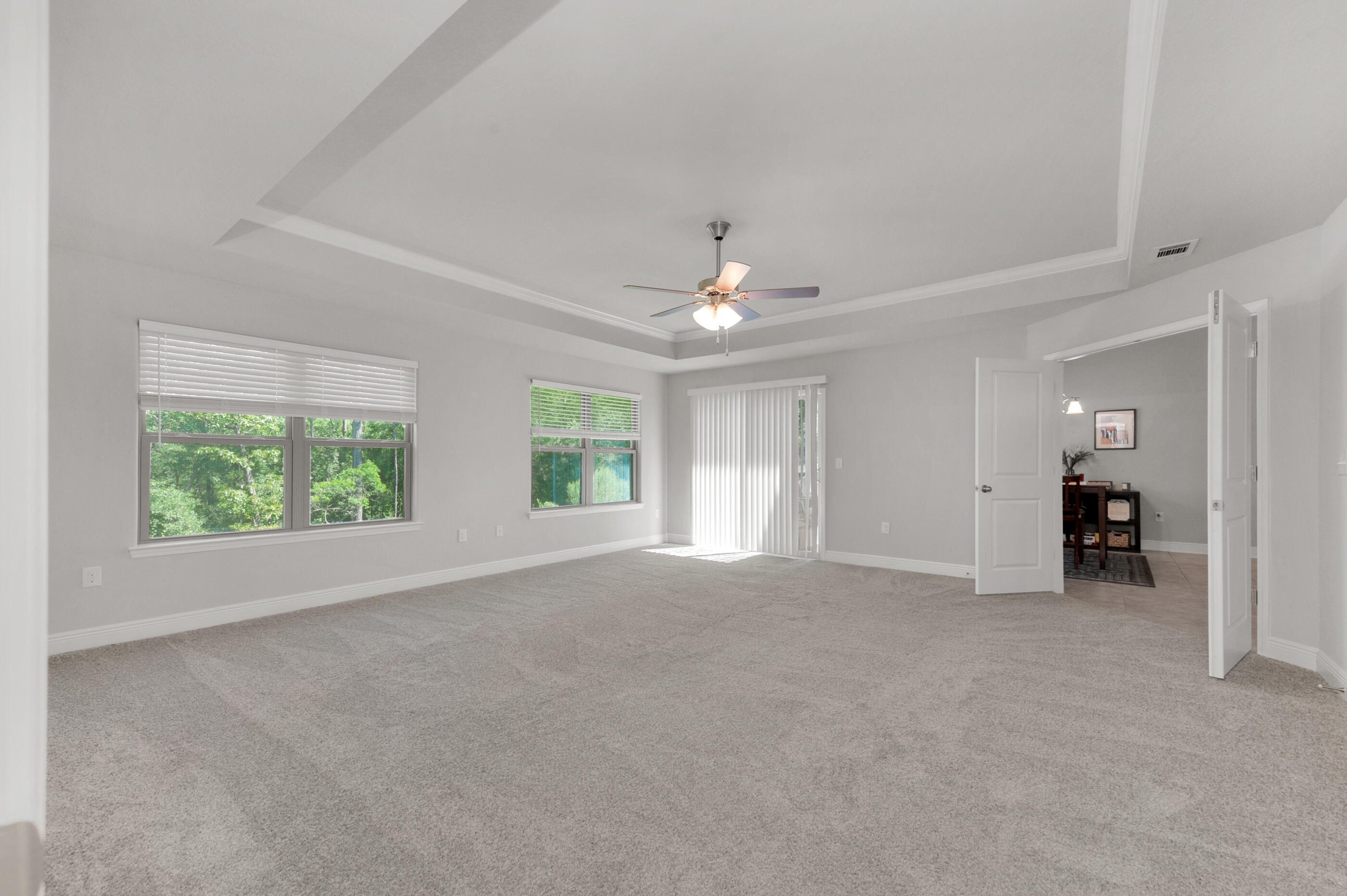 306 Vale Loop Crestview, FL 32536 - Photo 16 of 40 an empty room with windows and outdoor view