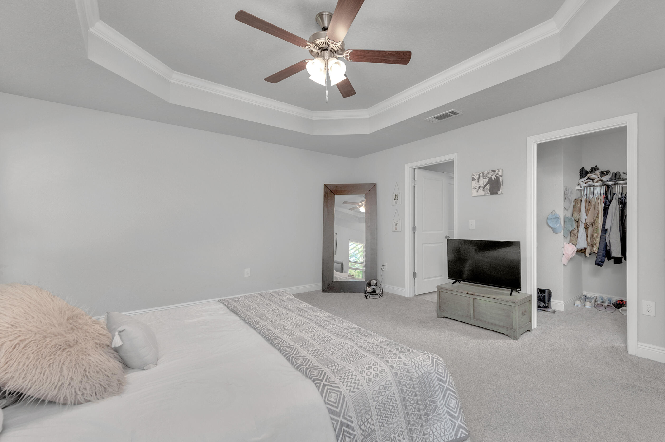 306 Vale Loop Crestview, FL 32536 - Photo 19 of 40 a bedroom with a bed and a flat screen tv