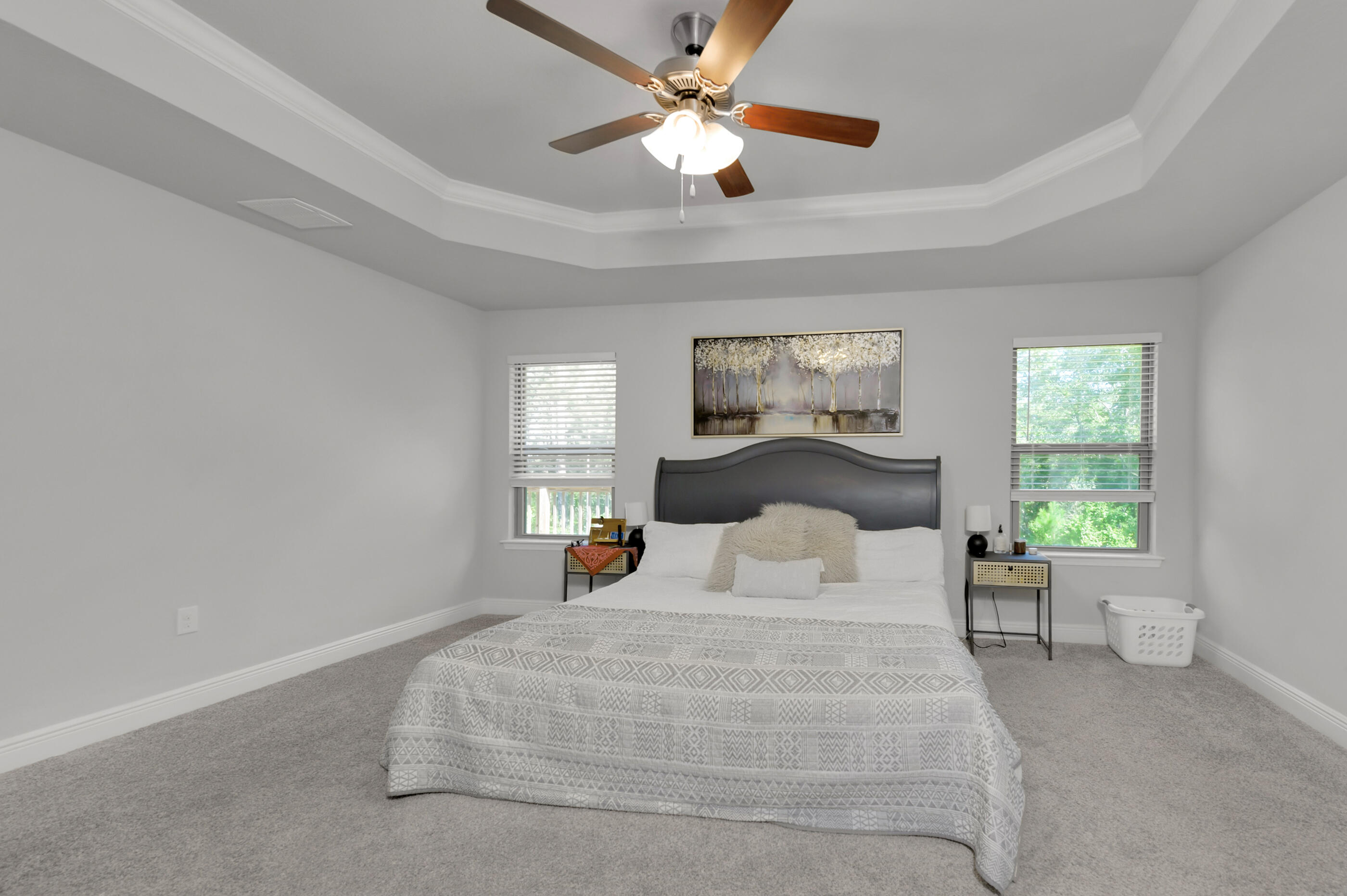 306 Vale Loop Crestview, FL 32536 - Photo 20 of 40 a bedroom with a large bed and a chandelier