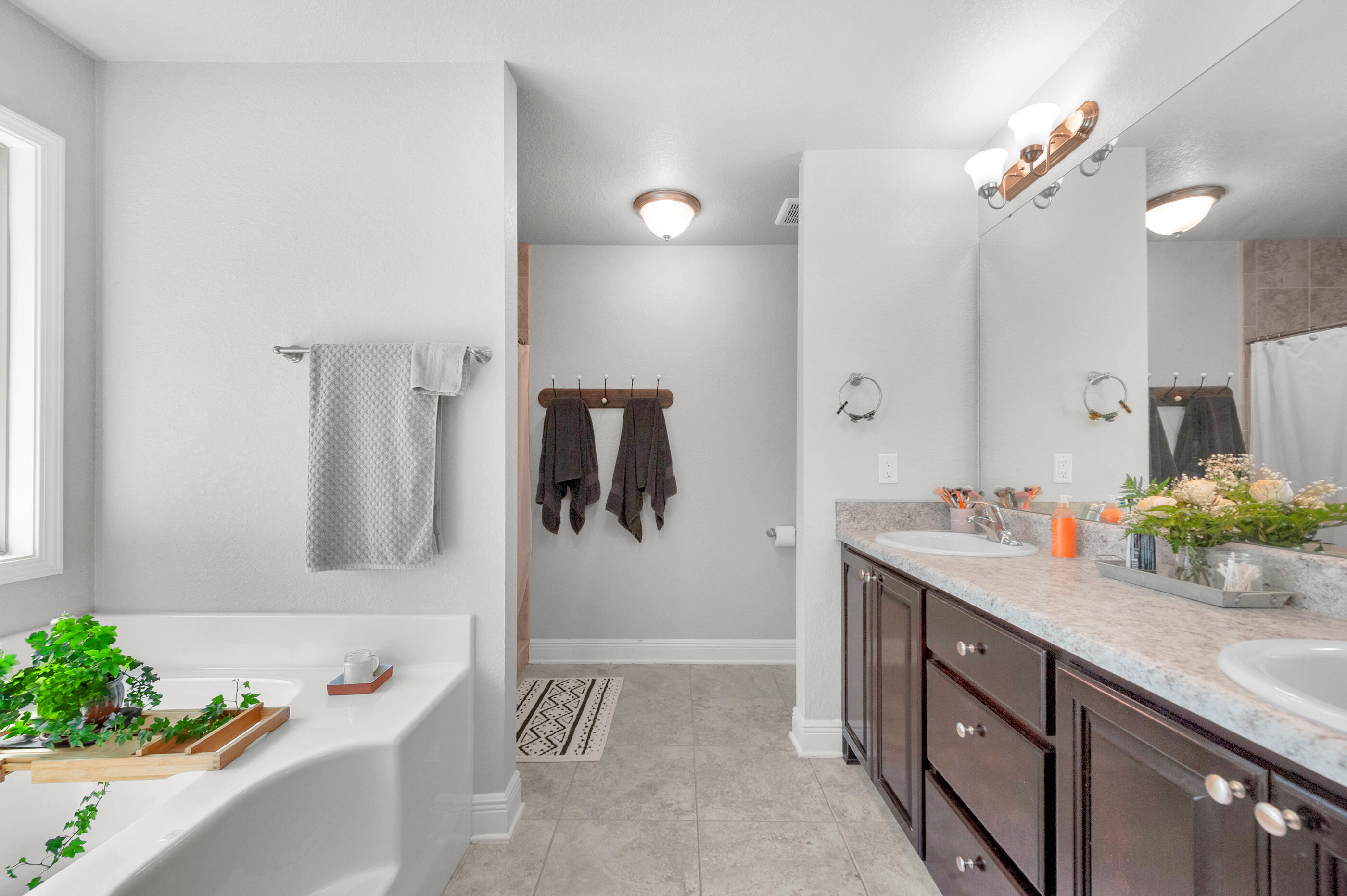 306 Vale Loop Crestview, FL 32536 - Photo 22 of 40 a bathroom with a sink vanity tub and a mirror