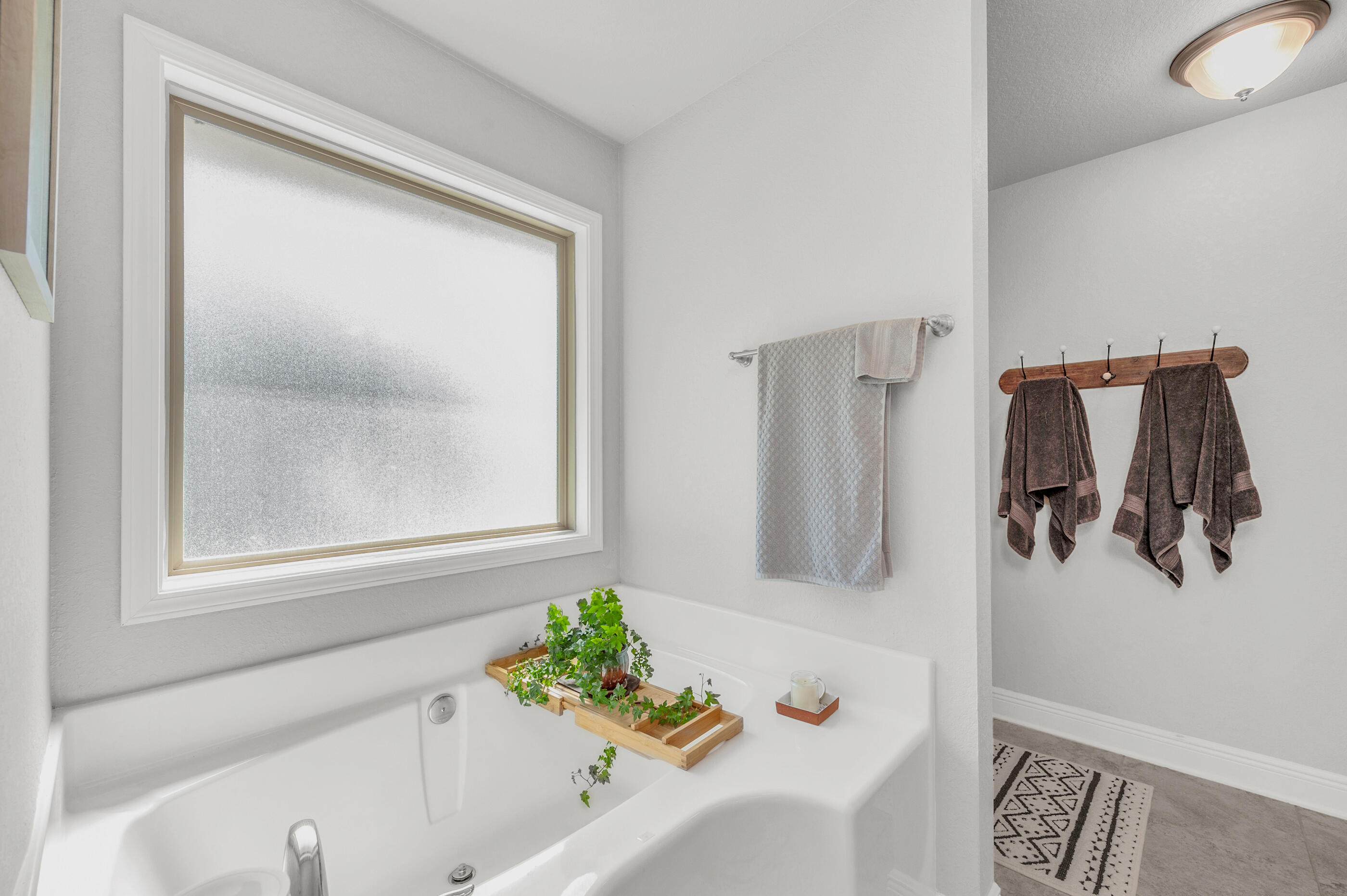 306 Vale Loop Crestview, FL 32536 - Photo 24 of 40 a bath room with a bathtub and a shower