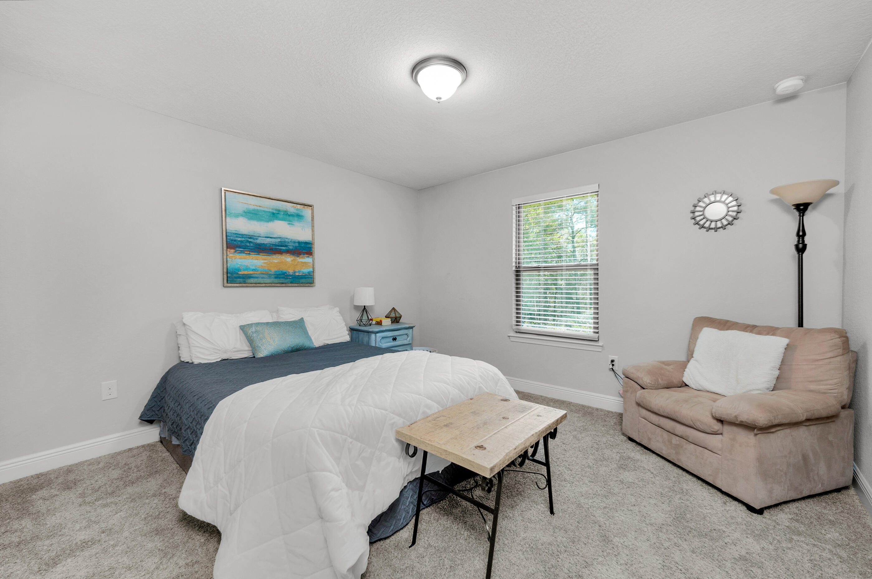 306 Vale Loop Crestview, FL 32536 - Photo 26 of 40 a bedroom with a bed and a couch
