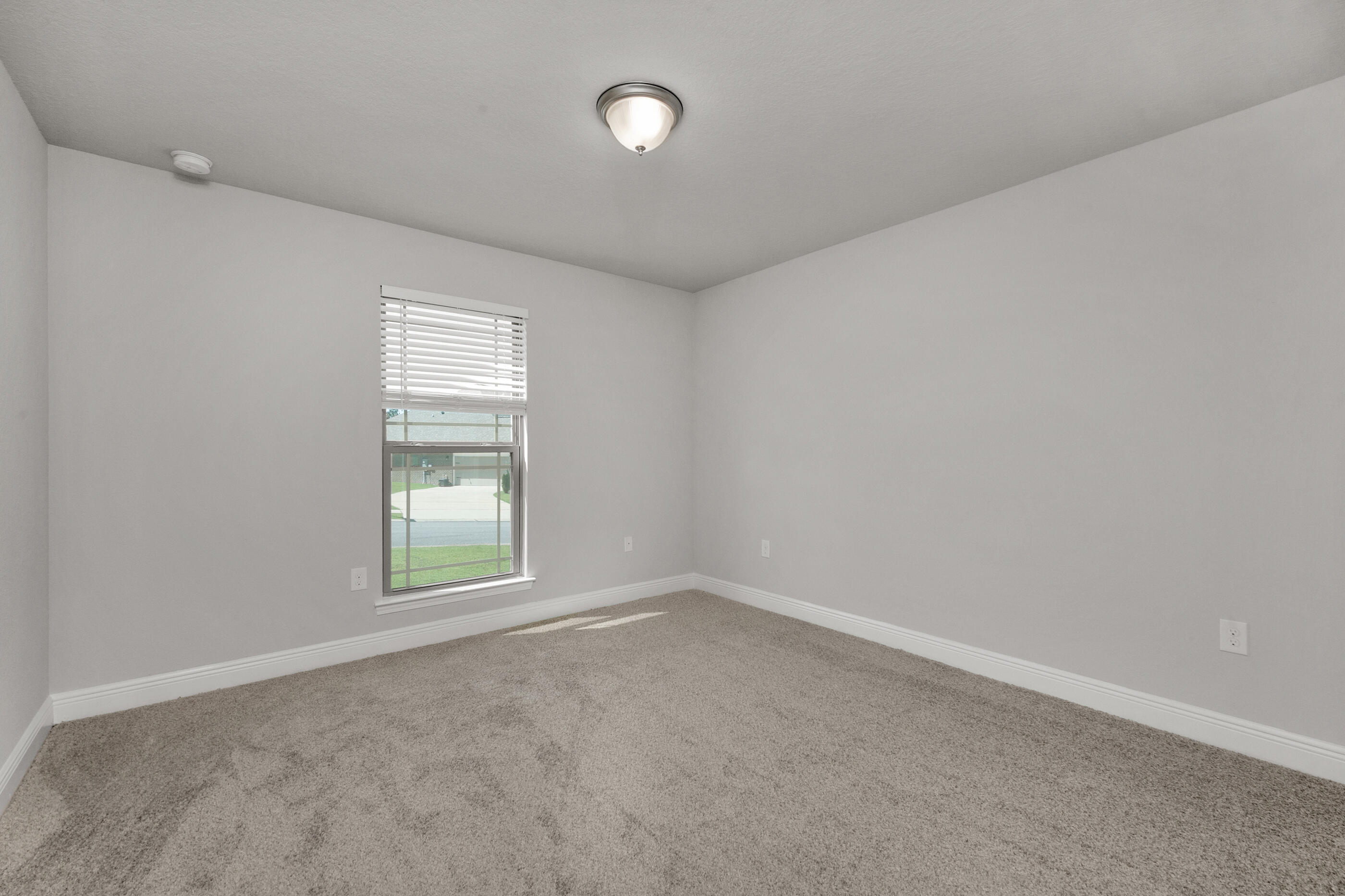 306 Vale Loop Crestview, FL 32536 - Photo 29 of 40 an empty room with windows