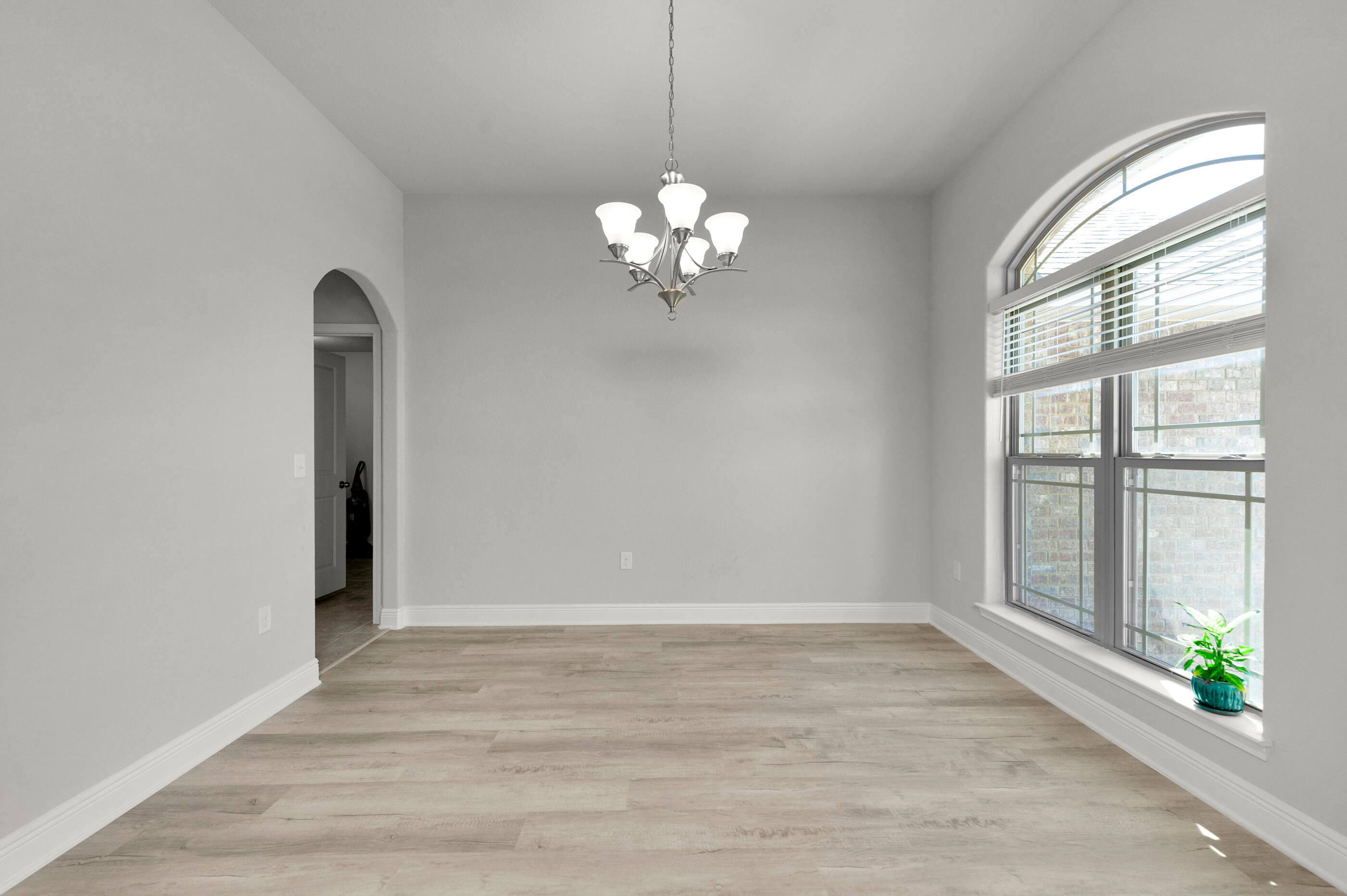 306 Vale Loop Crestview, FL 32536 - Photo 31 of 40 a view of a room with a chandelier fan and windows