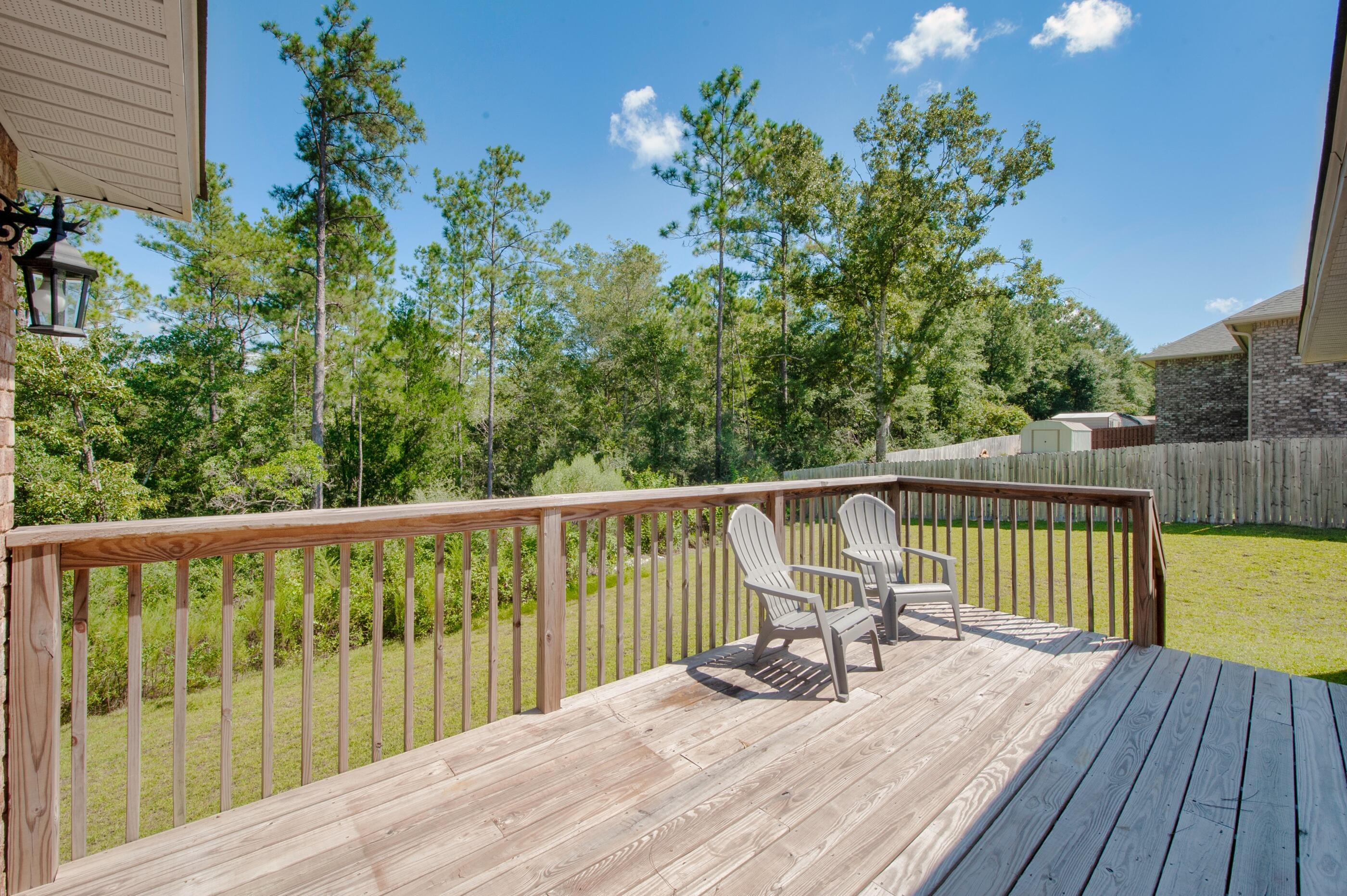 306 Vale Loop Crestview, FL 32536 - Photo 36 of 40 a view of balcony with wooden floor and seating space