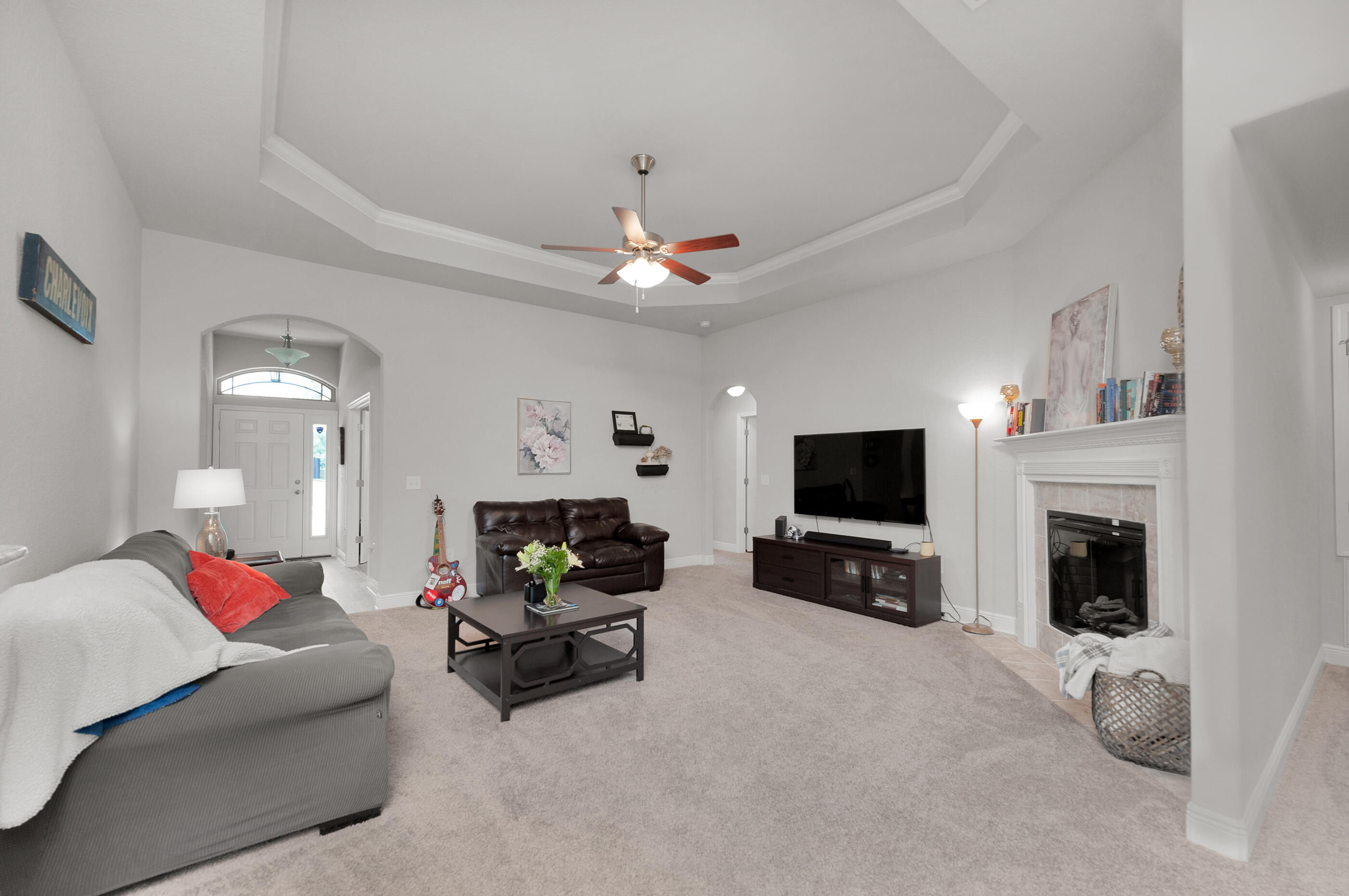 306 Vale Loop Crestview, FL 32536 - Photo 5 of 40 a living room with furniture flat screen tv and a fireplace