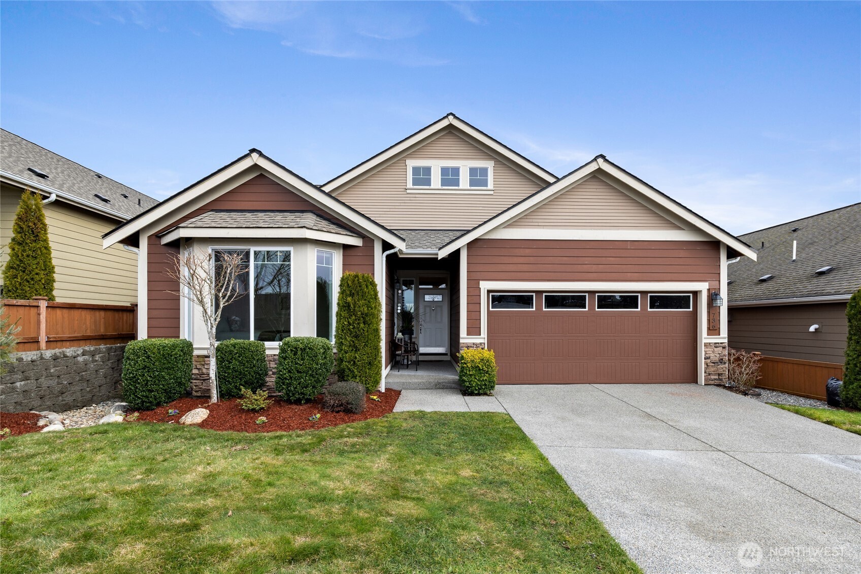 736 Mandee Street Southeast Lacey, WA 98513 - Photo 1 of 35 a front view of a house with a yard and garage