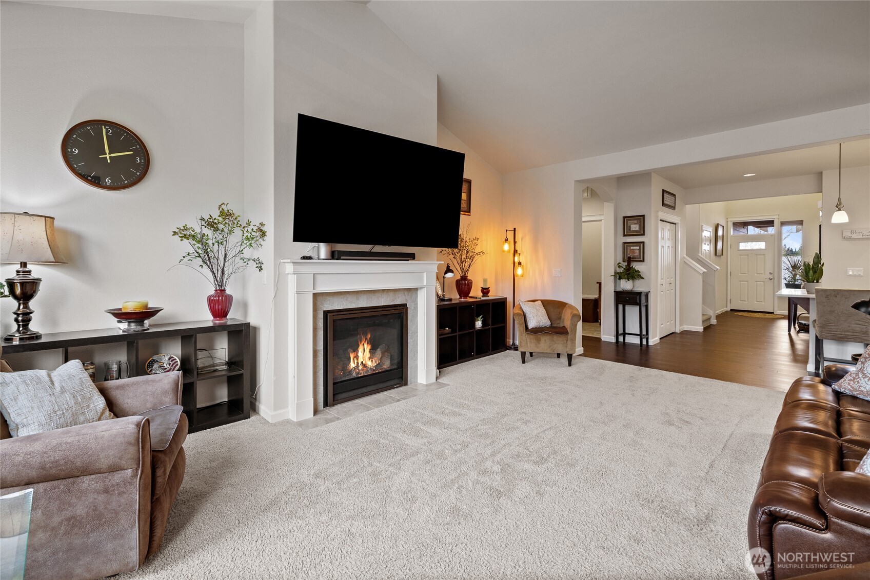 736 Mandee Street Southeast Lacey, WA 98513 - Photo 16 of 35 a living room with furniture a flat screen tv and a fireplace