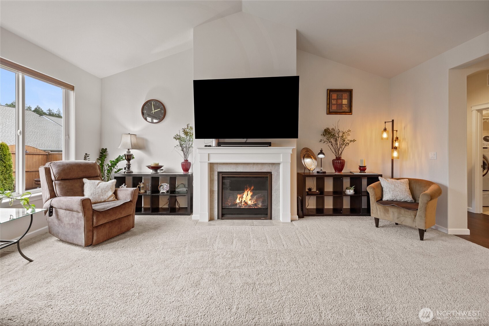 736 Mandee Street Southeast Lacey, WA 98513 - Photo 17 of 35 a living room with furniture a flat screen tv and a fireplace