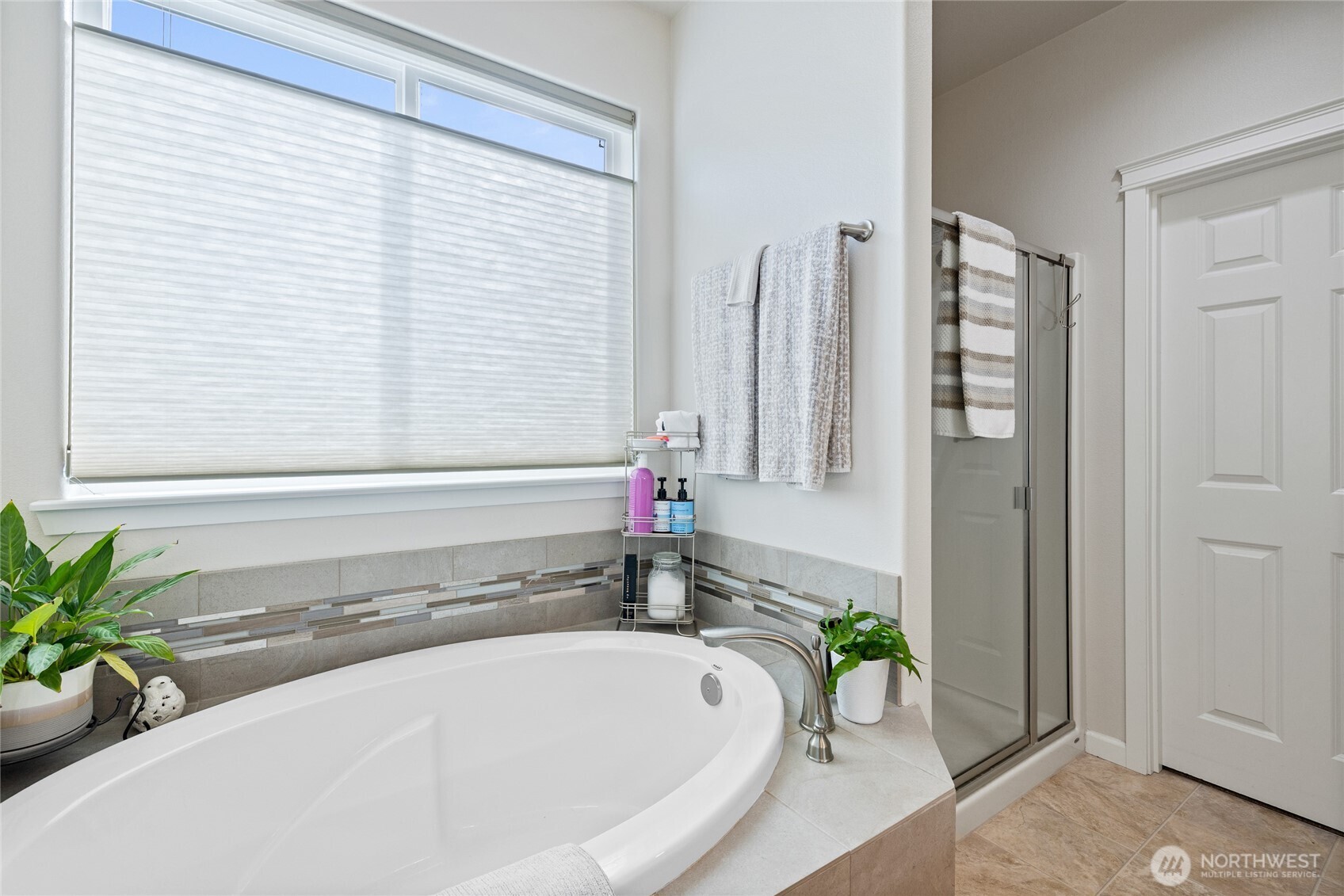 736 Mandee Street Southeast Lacey, WA 98513 - Photo 20 of 35 a bath tub sitting in a bathroom next to a window