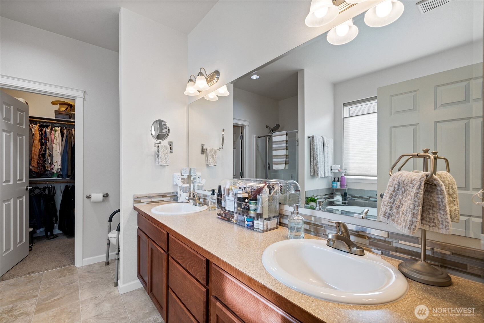 736 Mandee Street Southeast Lacey, WA 98513 - Photo 21 of 35 a bathroom with a double vanity sink and a mirror