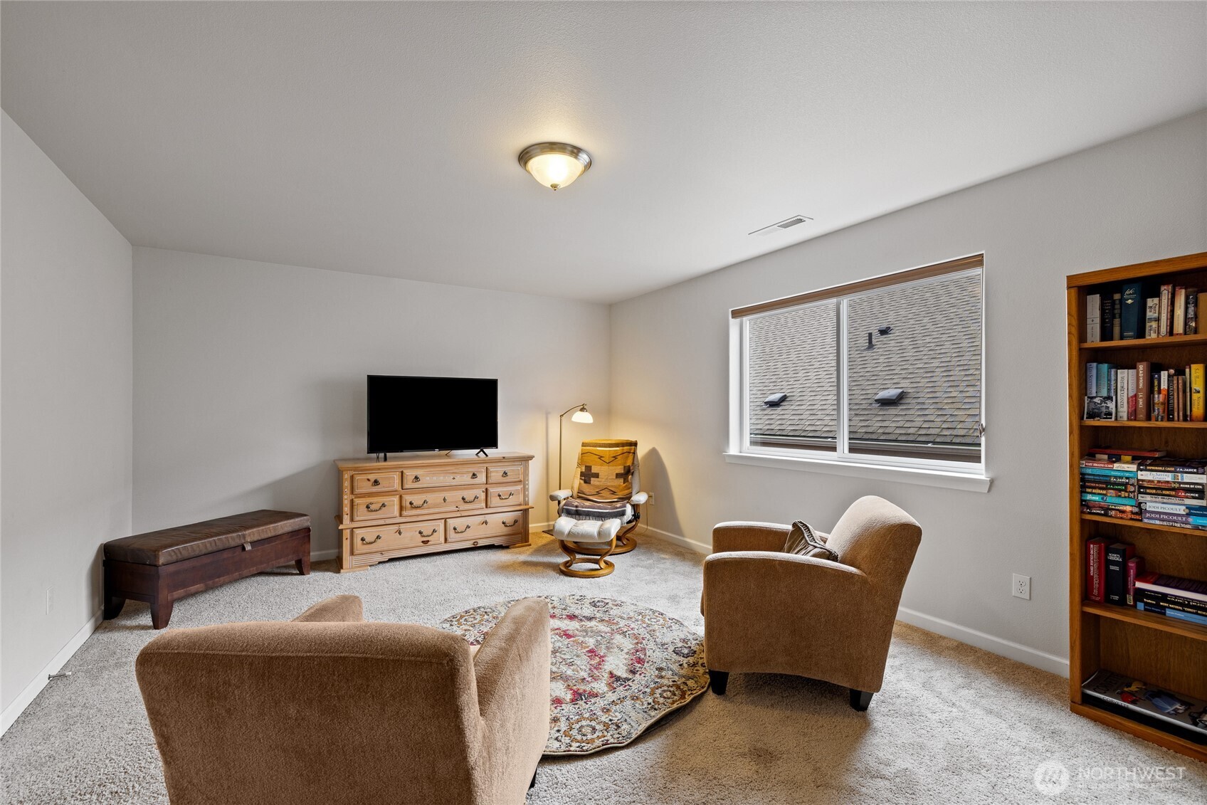 736 Mandee Street Southeast Lacey, WA 98513 - Photo 26 of 35 a bedroom with furniture and a flat screen tv