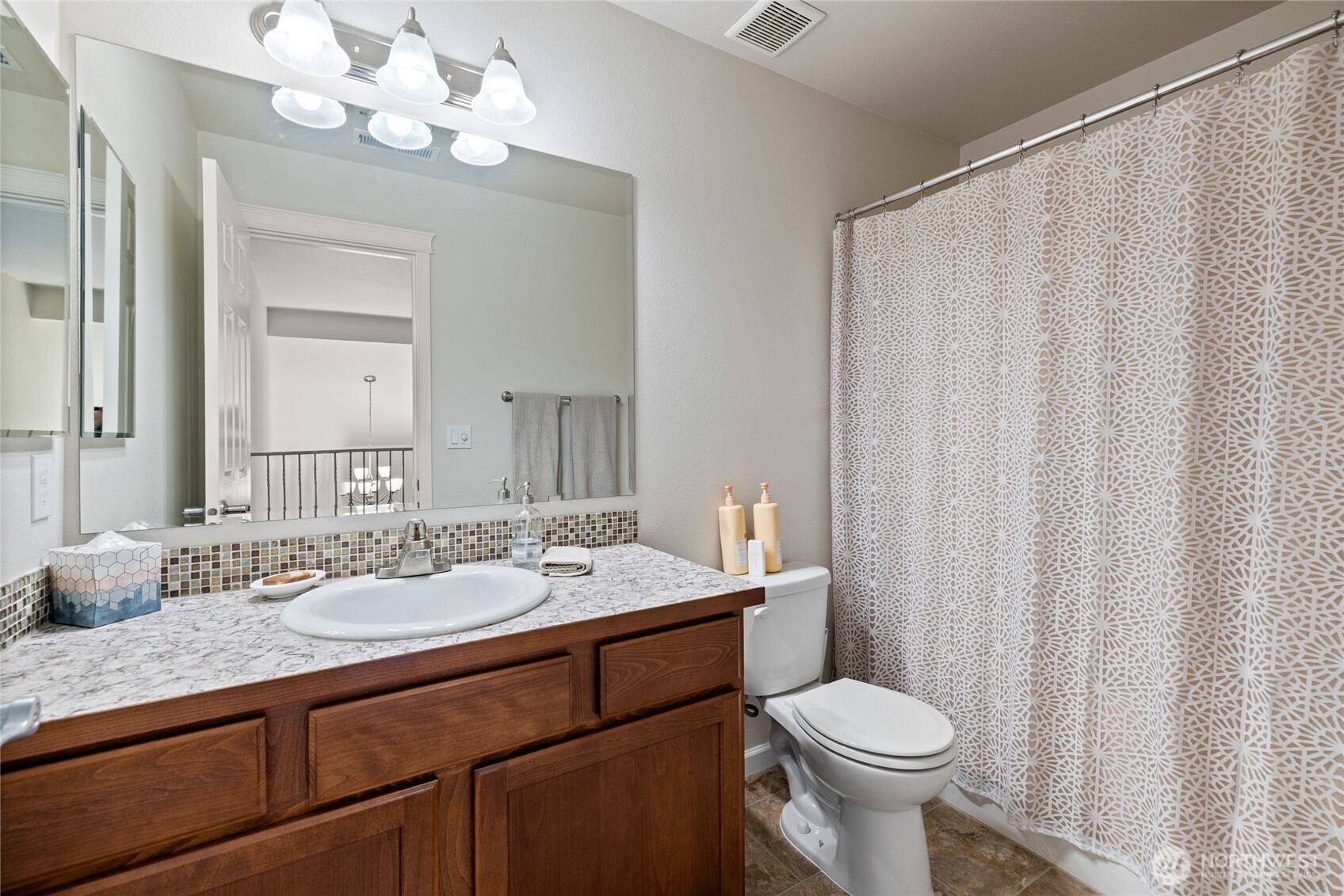 736 Mandee Street Southeast Lacey, WA 98513 - Photo 28 of 35 a bathroom with a sink a toilet and a mirror