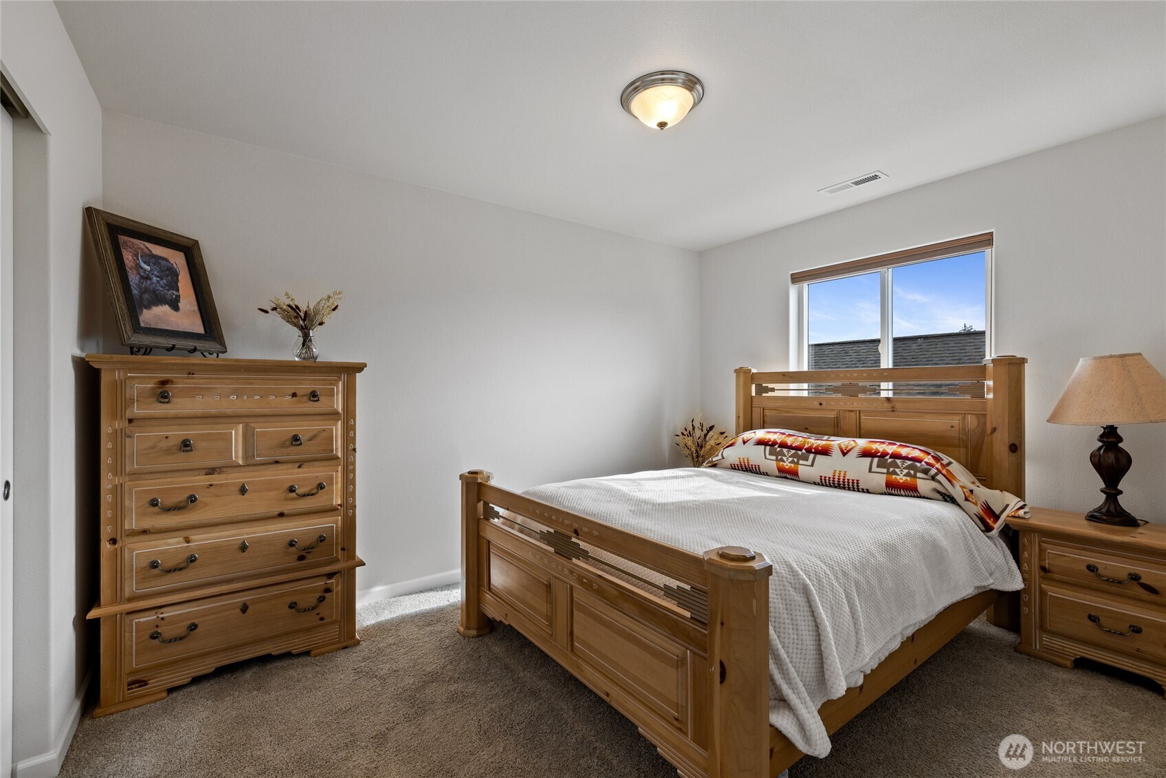 736 Mandee Street Southeast Lacey, WA 98513 - Photo 29 of 35 a bedroom with a bed and a dresser