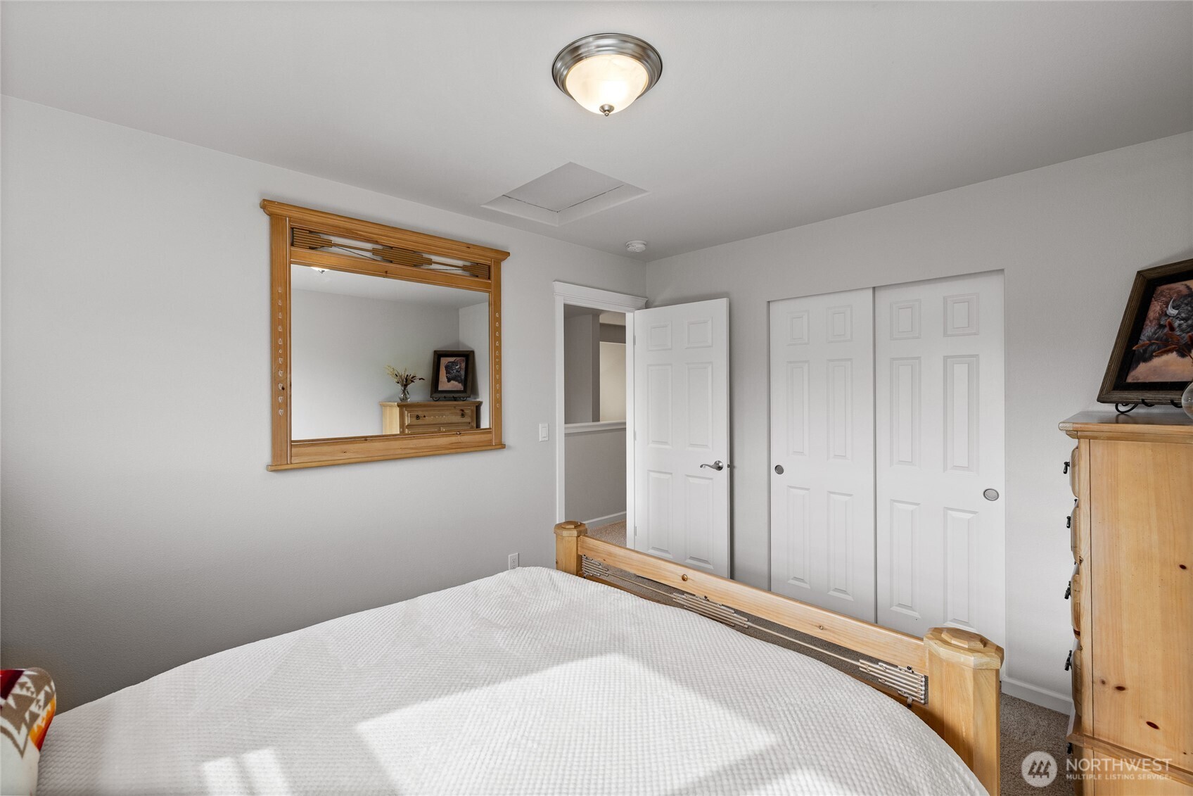 736 Mandee Street Southeast Lacey, WA 98513 - Photo 30 of 35 a bedroom with a bed and a painting on the wall