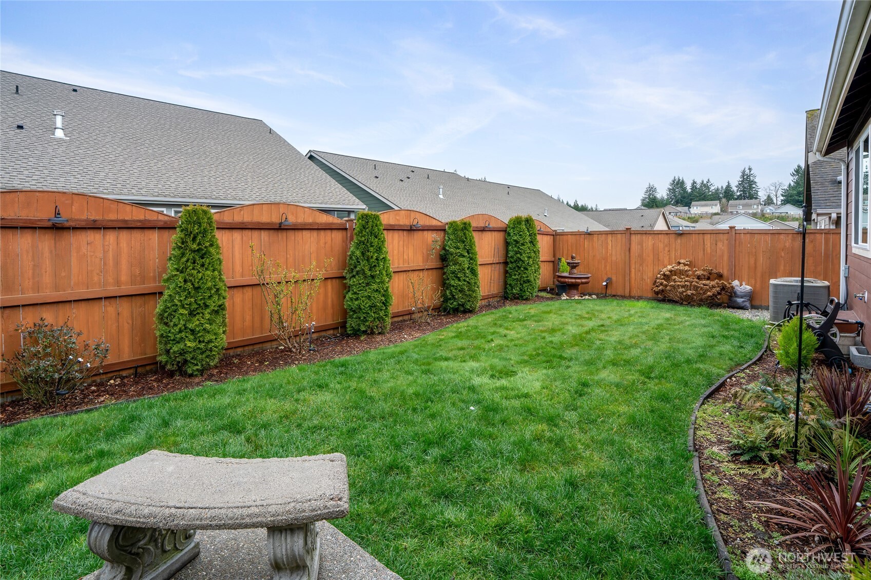 736 Mandee Street Southeast Lacey, WA 98513 - Photo 33 of 35 a view of a backyard with plants and a patio