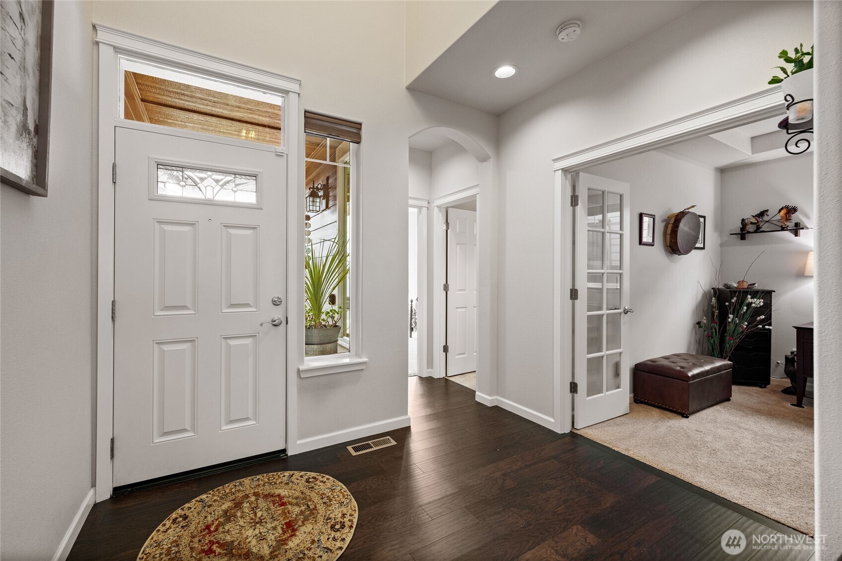 736 Mandee Street Southeast Lacey, WA 98513 - Photo 5 of 35 a view of a hallway with wooden floor and closet