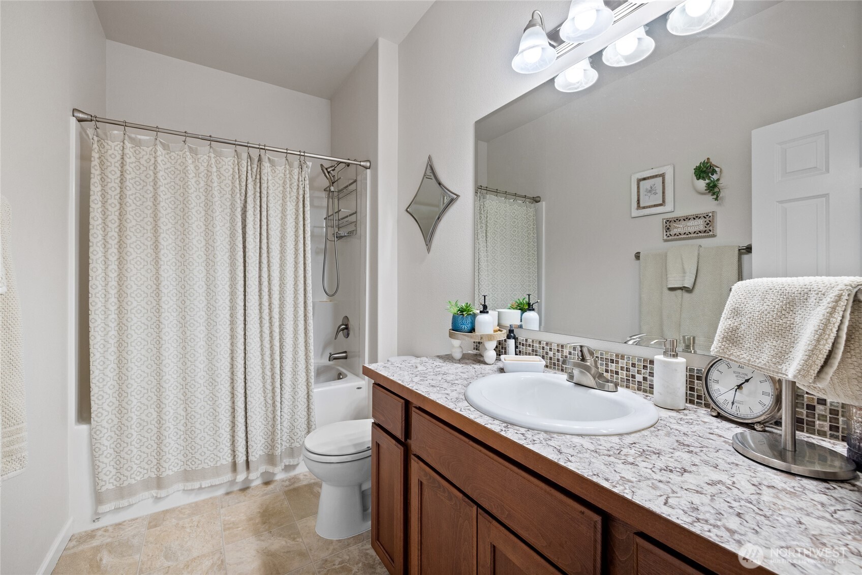 736 Mandee Street Southeast Lacey, WA 98513 - Photo 7 of 35 a bathroom with a granite countertop sink a toilet and a mirror