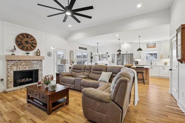 a bathroom with a double vanity sink a mirror and a shower