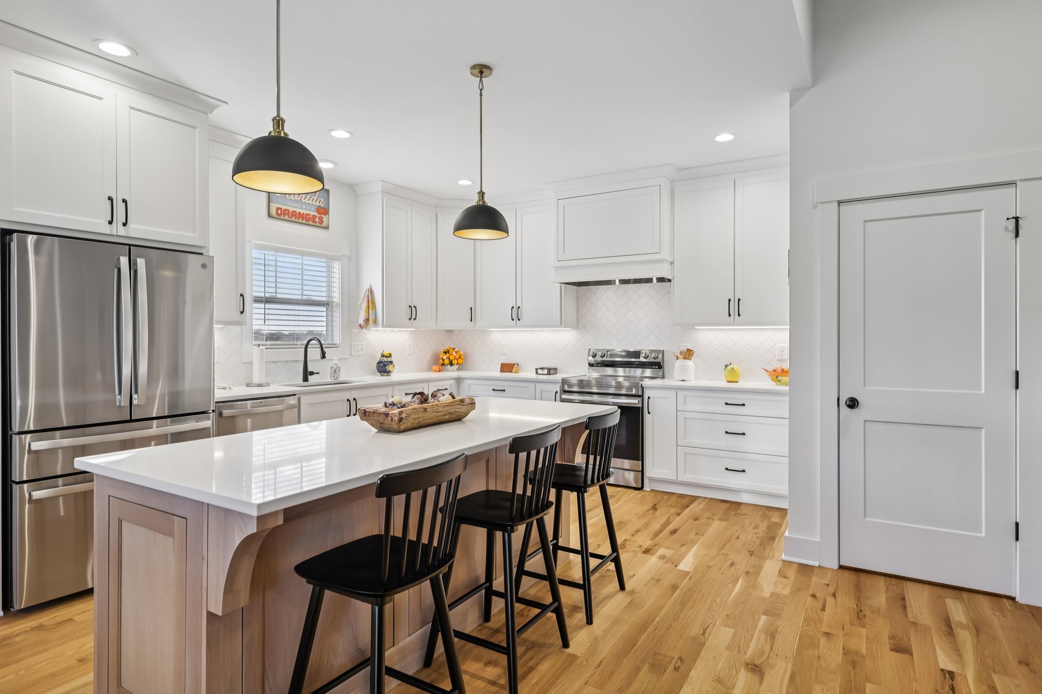 5685 Minnis Road Springfield, TN 37172 - Photo 22 of 93 a kitchen with stainless steel appliances kitchen island granite countertop a table chairs and a refrigerator