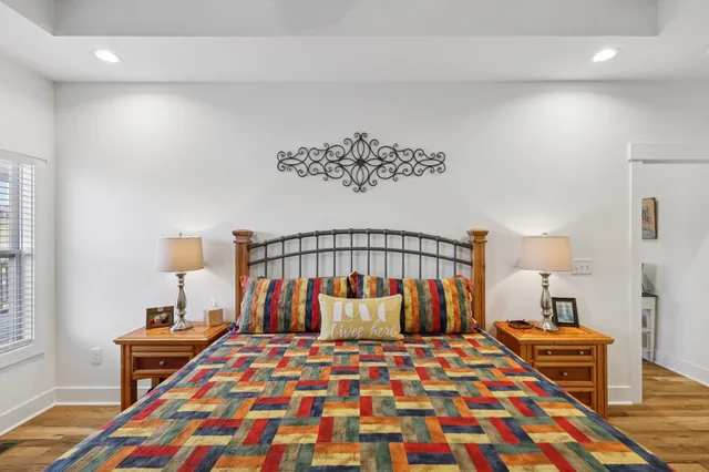 a view of a house with a big yard and large trees