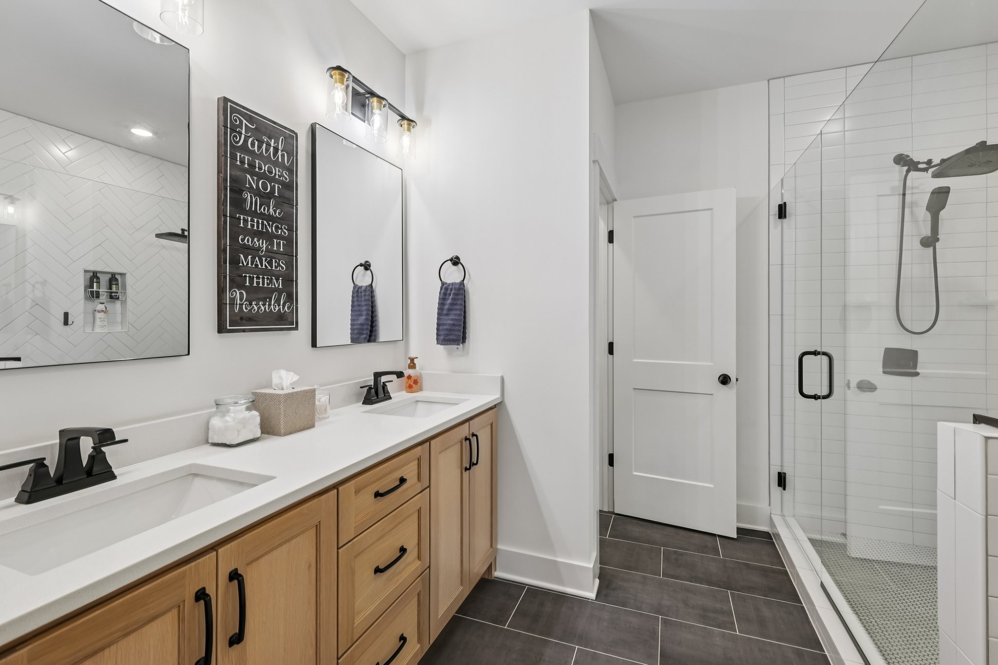 5685 Minnis Road Springfield, TN 37172 - Photo 38 of 93 a bathroom with a double vanity sink a mirror and a shower