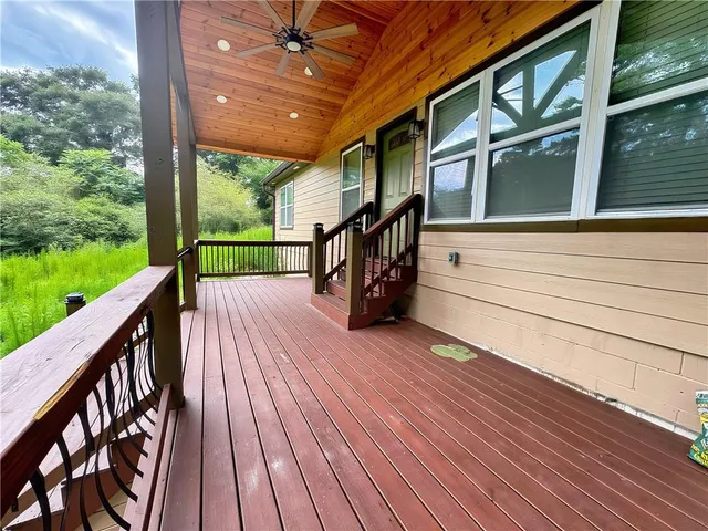 a view of a balcony with wooden floor