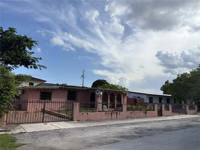 a view of a house next to a yard