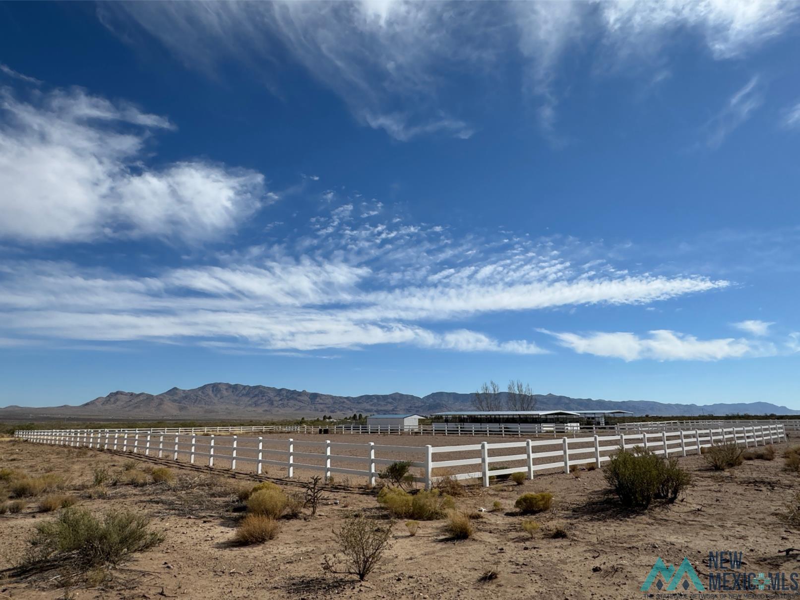 Tbd Tbd Caballos Road Rodeo, NM 88056 - Photo 4 of 46 View of yard featuring an enclosed horse arena and a mountain view