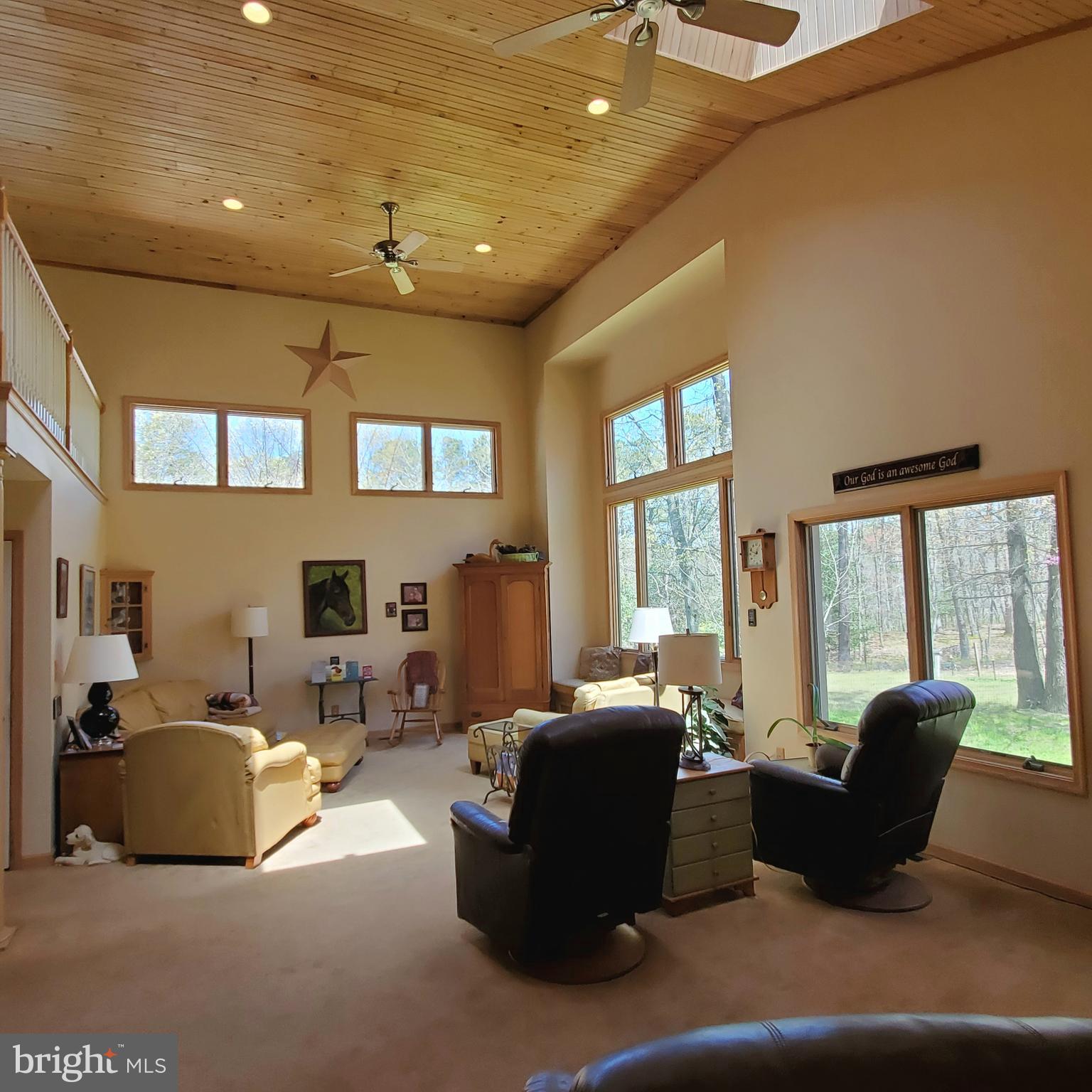 36 Cobbs Mill Road Alloway, NJ 08302 - Photo 16 of 41 a living room with furniture large window and flat screen tv
