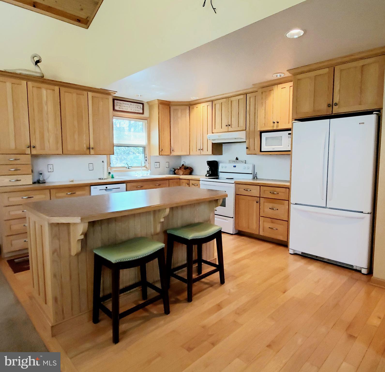 36 Cobbs Mill Road Alloway, NJ 08302 - Photo 18 of 41 a kitchen with a sink a stove a refrigerator and white cabinets