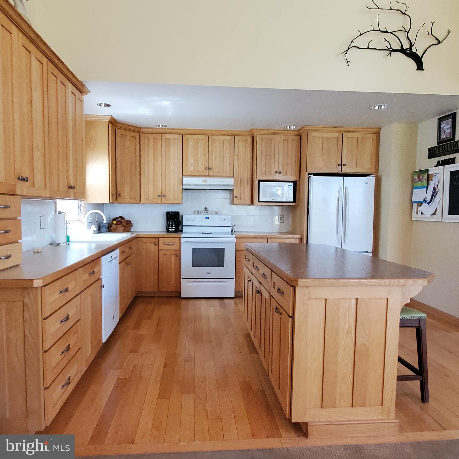36 Cobbs Mill Road Alloway, NJ 08302 - Photo 20 of 41 a kitchen with wooden cabinets and sink