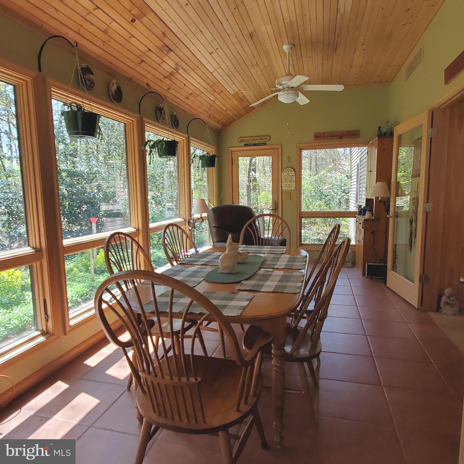 36 Cobbs Mill Road Alloway, NJ 08302 - Photo 22 of 41 a dining room with furniture a chandelier and wooden floor