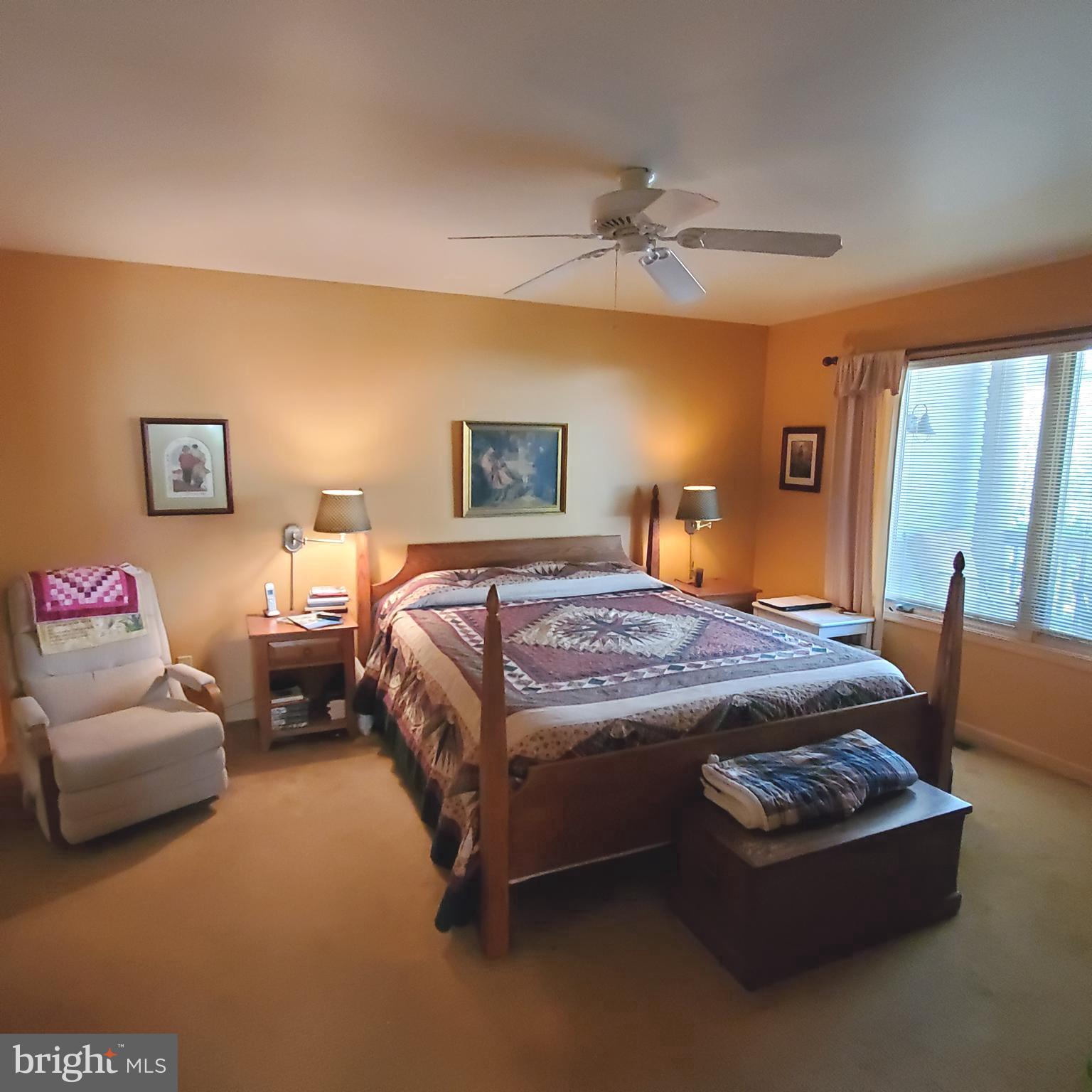 36 Cobbs Mill Road Alloway, NJ 08302 - Photo 24 of 41 a bedroom with a bed and a chandelier
