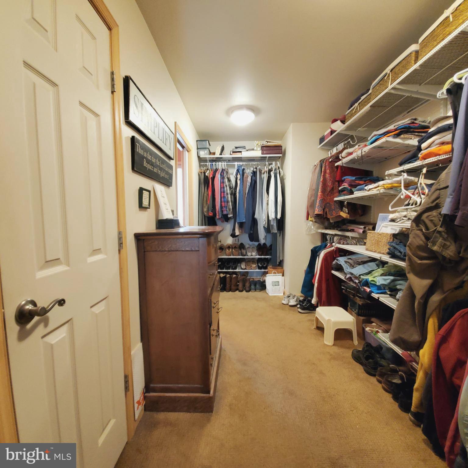 36 Cobbs Mill Road Alloway, NJ 08302 - Photo 29 of 41 a view of walk in closet with clothes