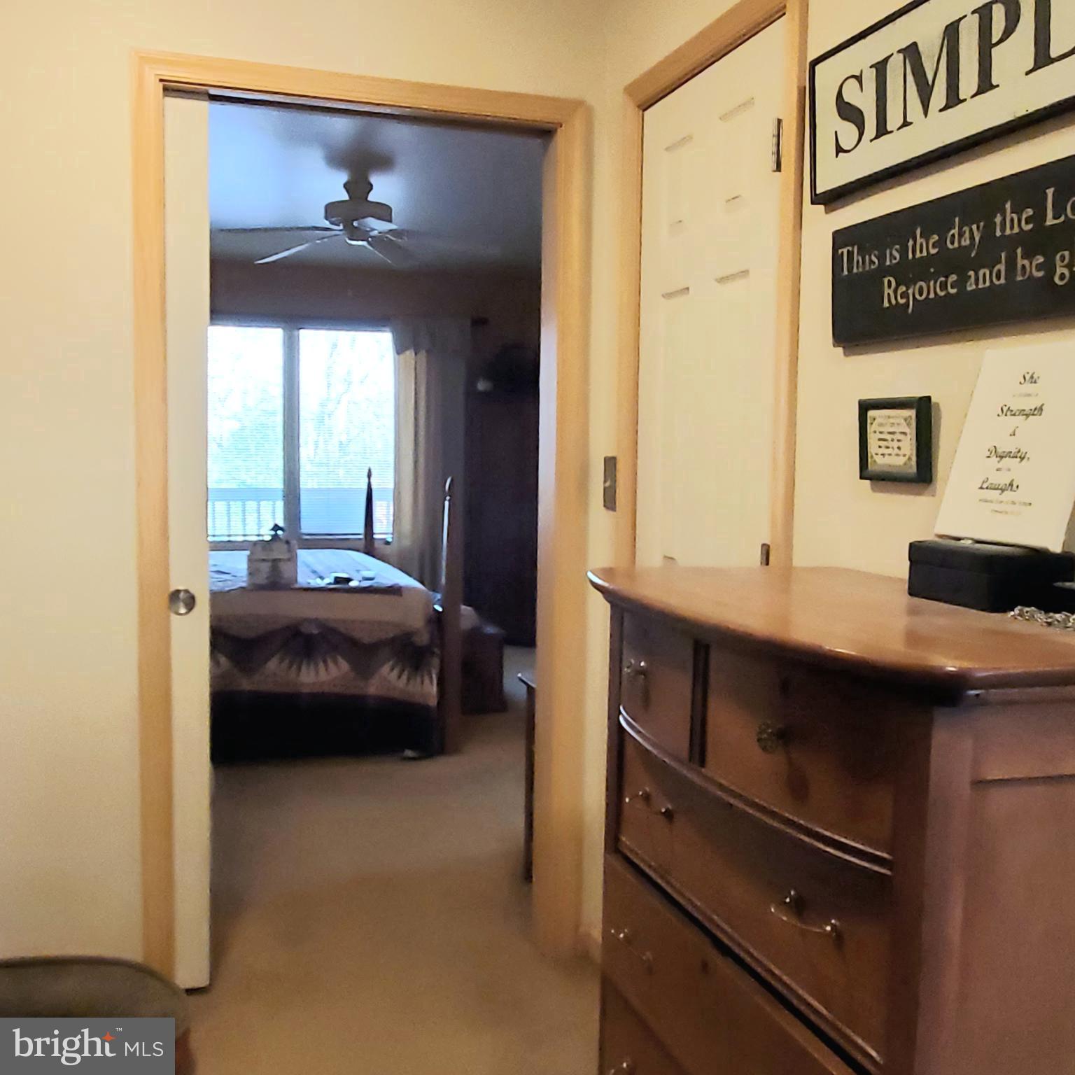 36 Cobbs Mill Road Alloway, NJ 08302 - Photo 30 of 41 a bedroom with a bed and a mirror