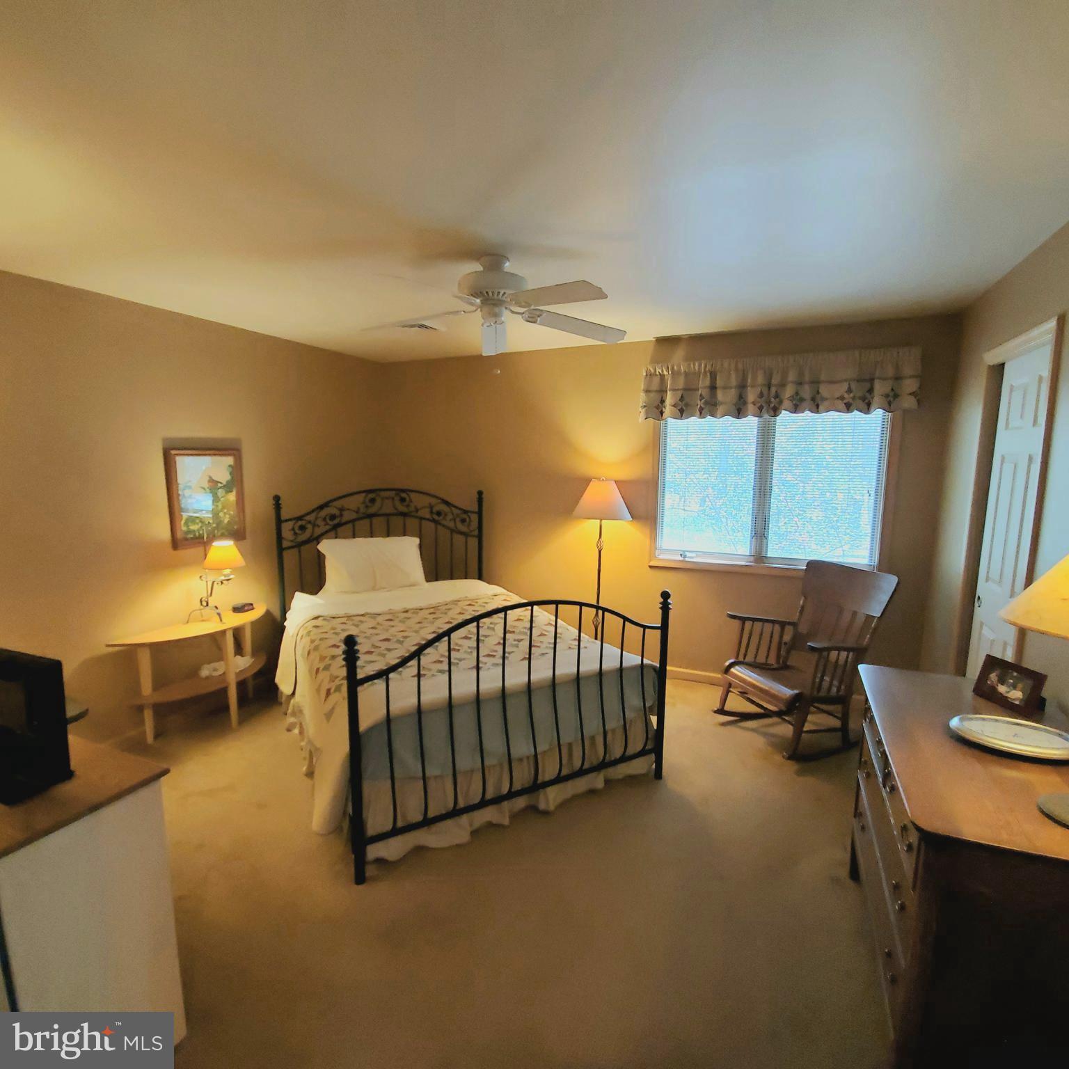 36 Cobbs Mill Road Alloway, NJ 08302 - Photo 37 of 41 a bedroom with a bed and wooden floor