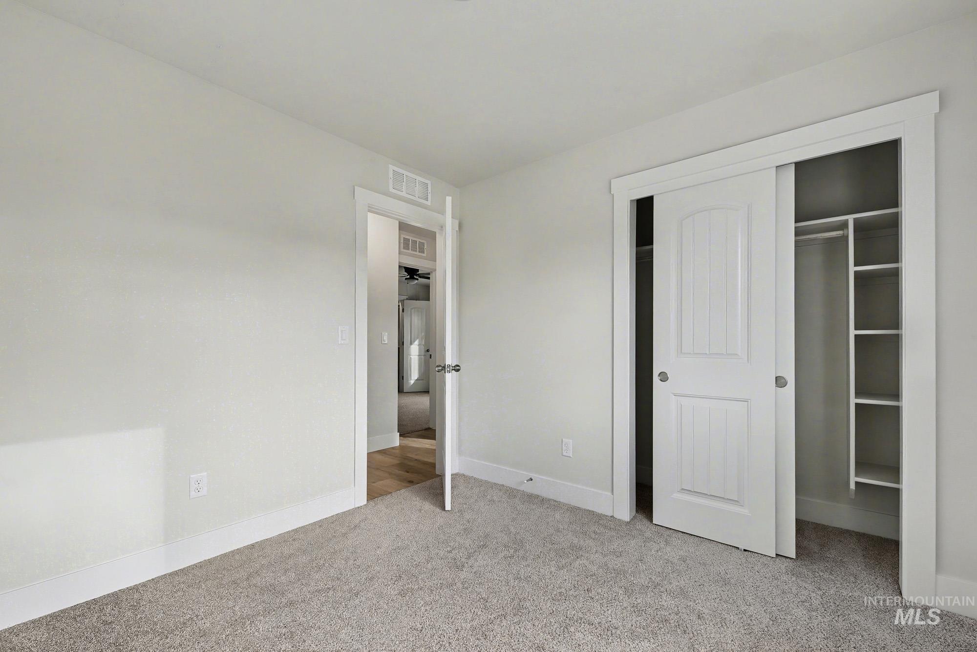 326 Packer Lane Homedale, ID 83628 - Photo 19 of 24 Unfurnished bedroom featuring light colored carpet and a closet