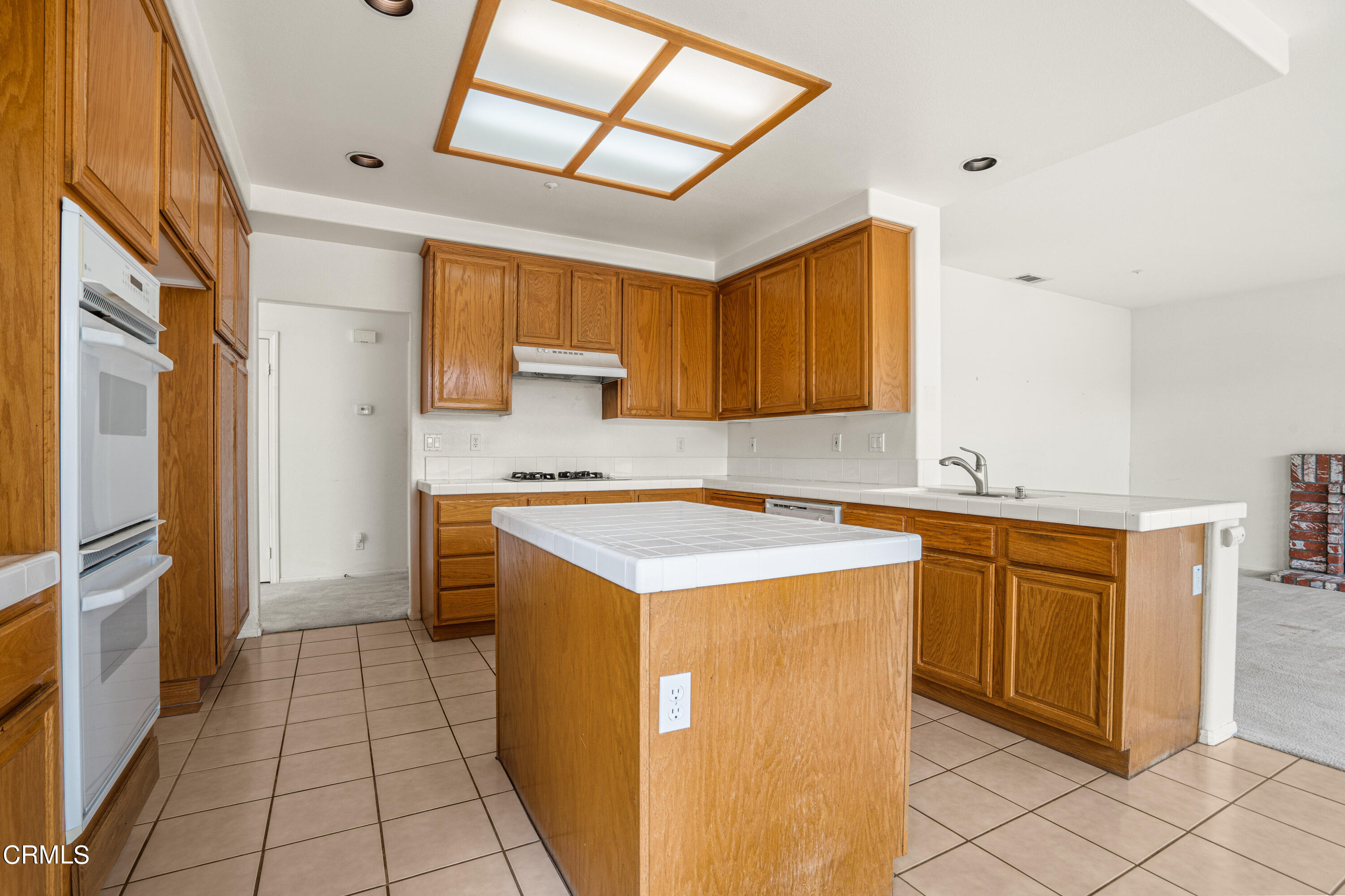 2410 Ivory Way Oxnard, CA 93036 - Photo 11 of 64 a kitchen with stainless steel appliances granite countertop a sink and cabinets