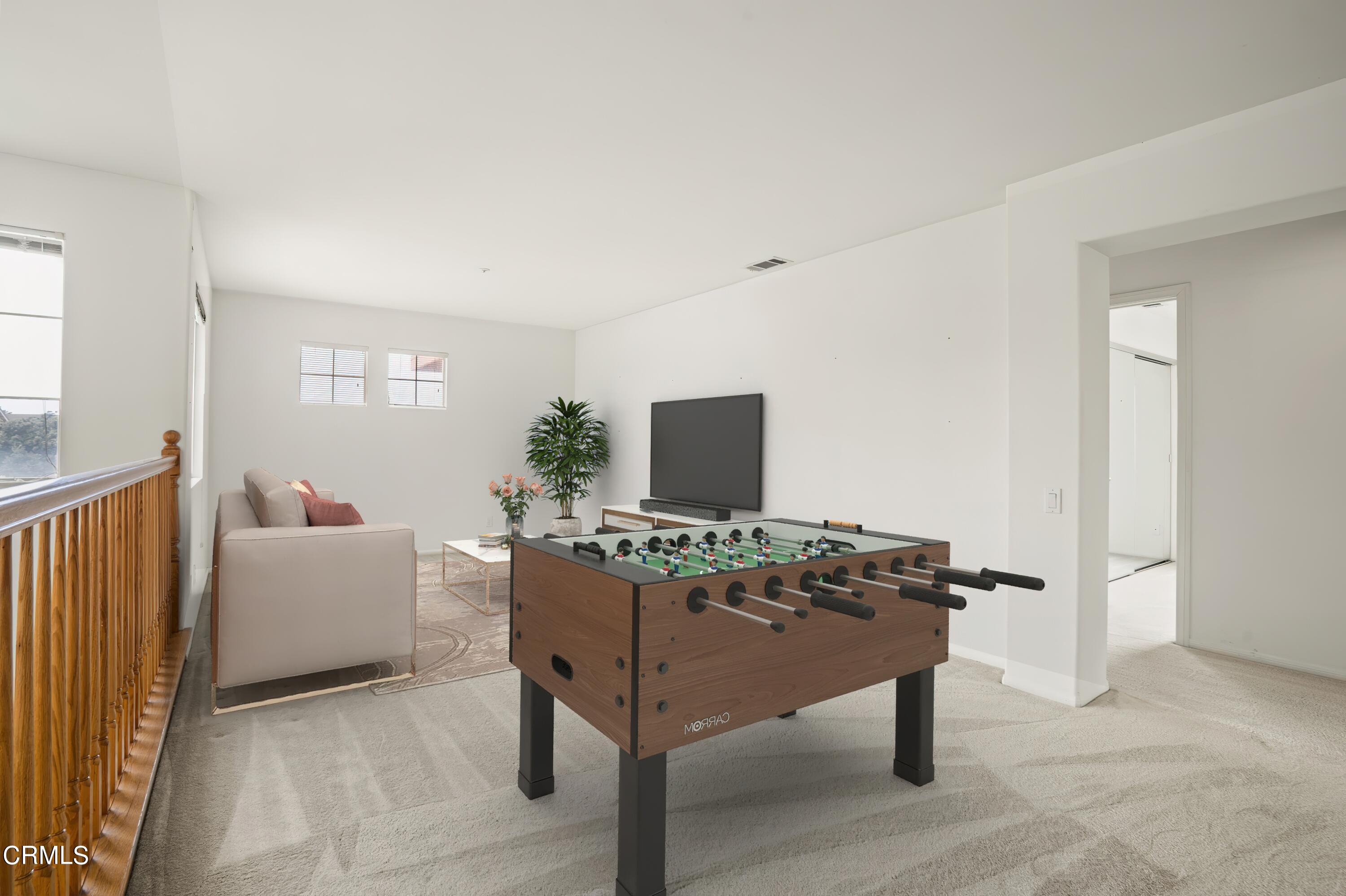 2410 Ivory Way Oxnard, CA 93036 - Photo 26 of 64 a living room with furniture and a flat screen tv