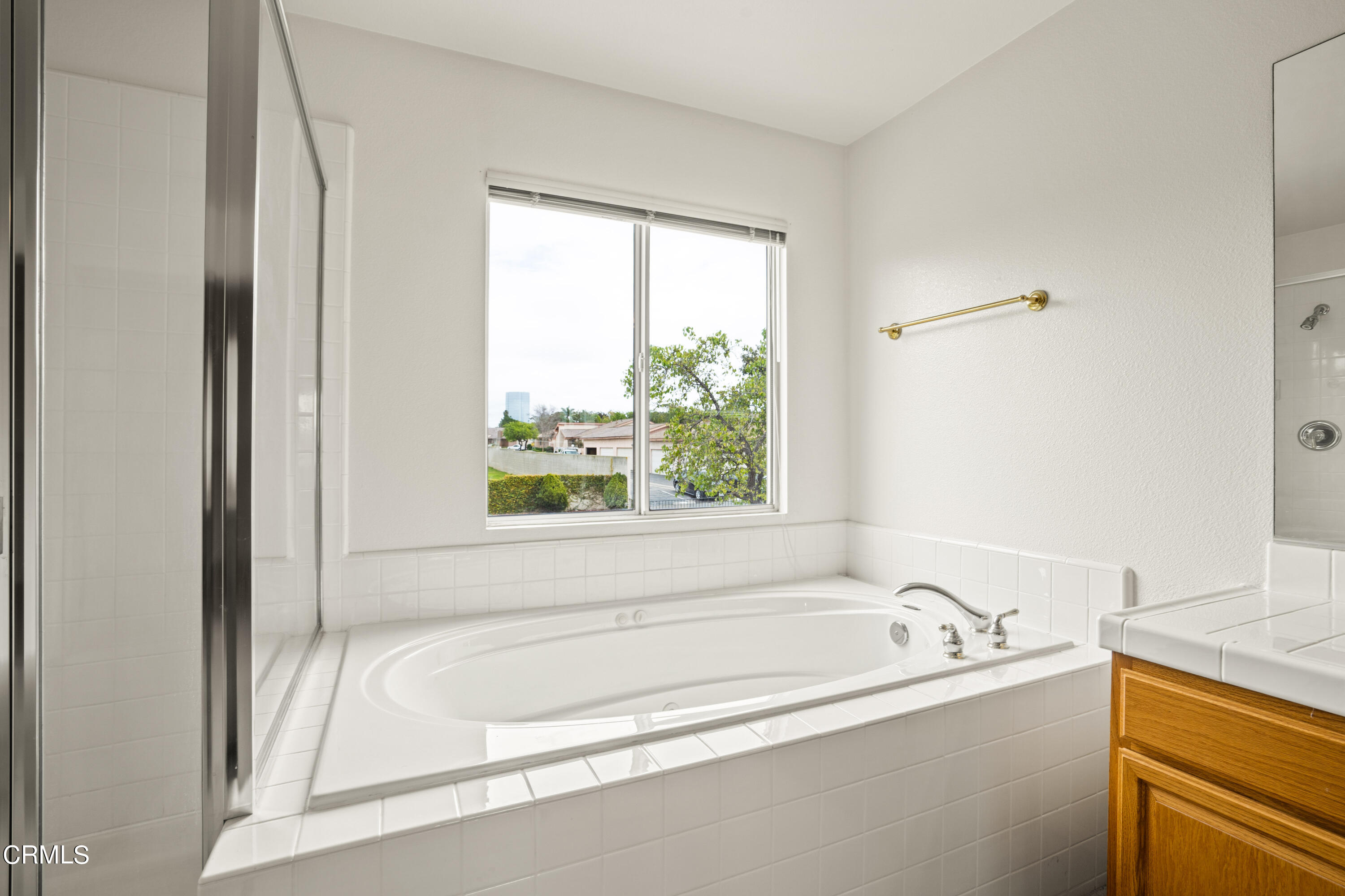 2410 Ivory Way Oxnard, CA 93036 - Photo 47 of 64 a bathroom with a bathtub and a shower