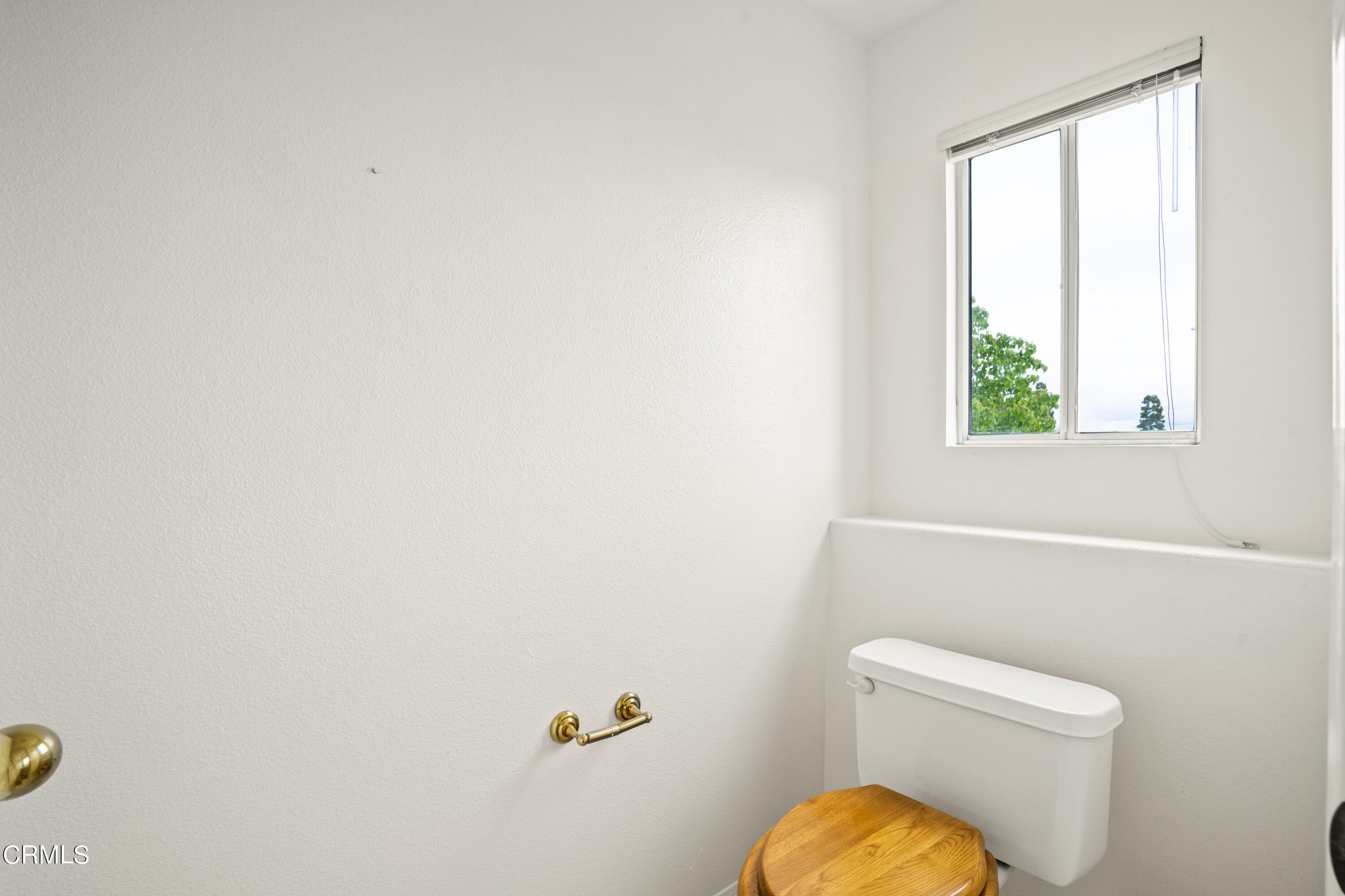 2410 Ivory Way Oxnard, CA 93036 - Photo 48 of 64 a bathroom with a toilet and a window