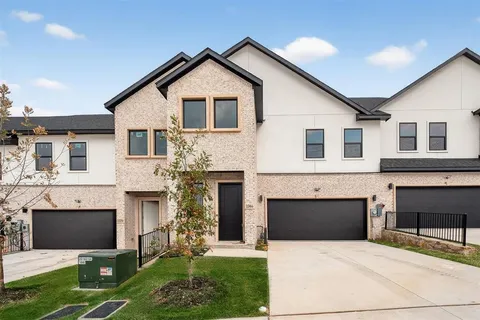 a front view of a house with yard