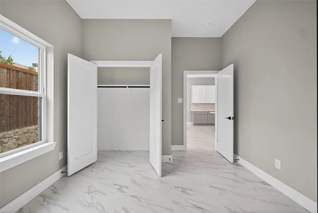 a kitchen with stainless steel appliances granite countertop a sink a stove and microwave