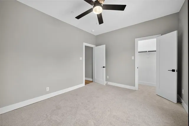 a bathroom with a double vanity sink and mirror