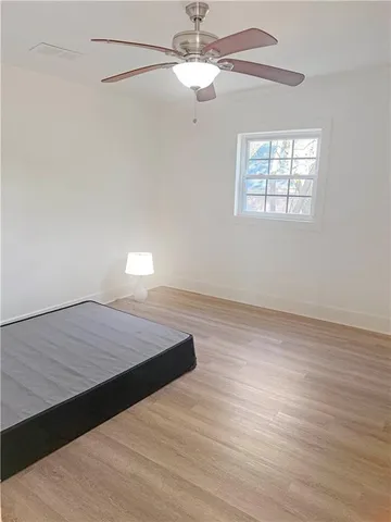 a room with a bed and a window