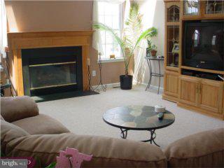 126 Willow Grove Road Shamong, NJ 08088 - Photo 3 of 6 a living room with furniture and a fireplace
