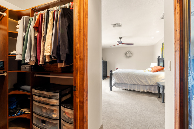 892 Cambridge Drive St. George, UT 84770 - Photo 49 of 65 Built-in wood-finish closet system with multiple hanging rods and shelving units