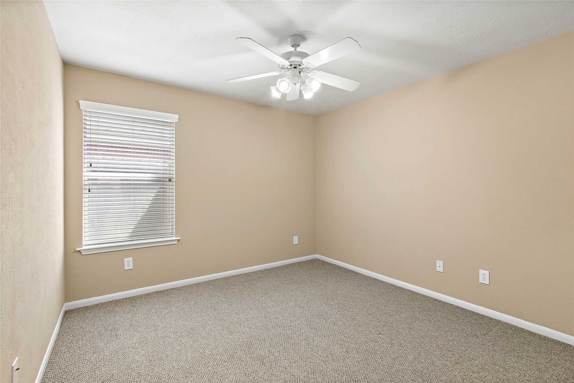 30411 Deleon Fields Drive Spring, TX 77386 - Photo 18 of 24 Third bedroom also features a ceiling fan and spacious closet.